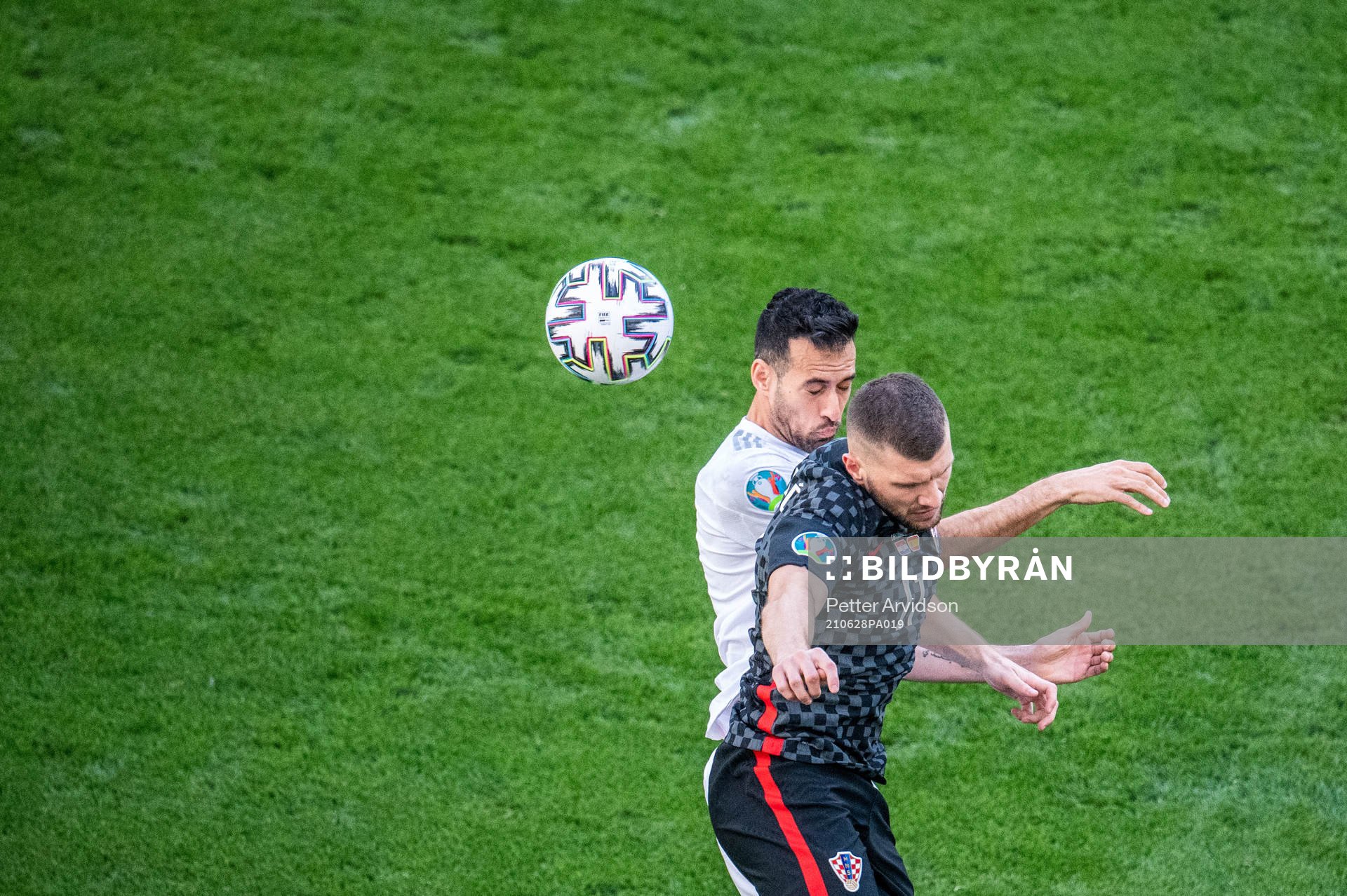 Ante Rebic of Croatia and Sergio Busquets of Spain