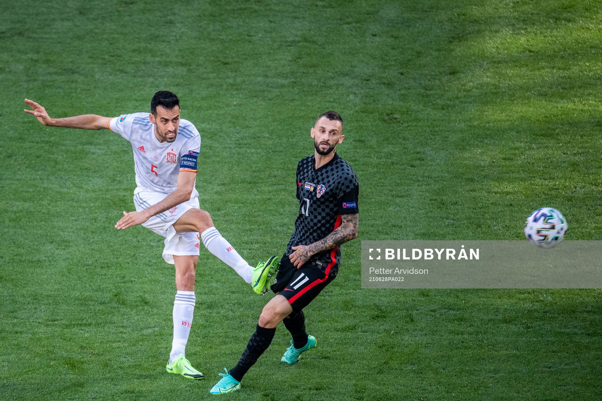 Sergio Busquets of Spain and Marcelo Brozovic of Croatia