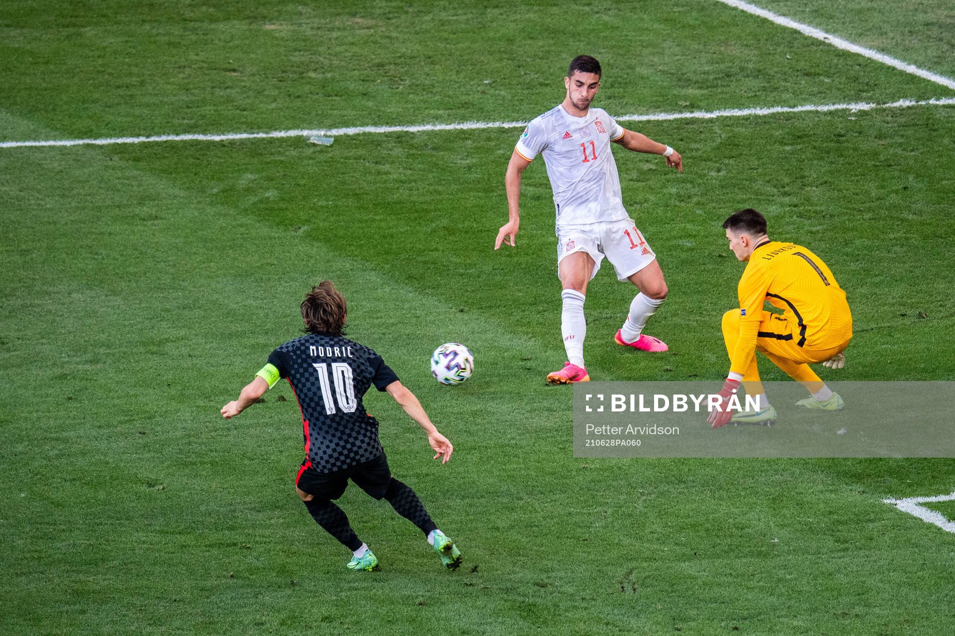 Ferran Torres of Spain and Luka Modric and goalkeeper