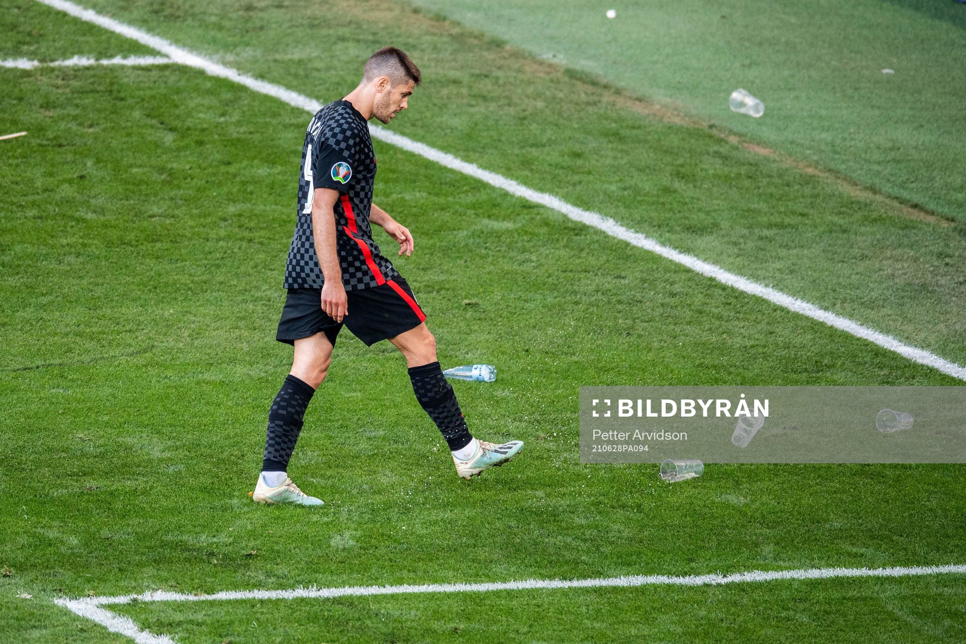 Andrej Kramaric of Croatia kicks away cops from the pitch