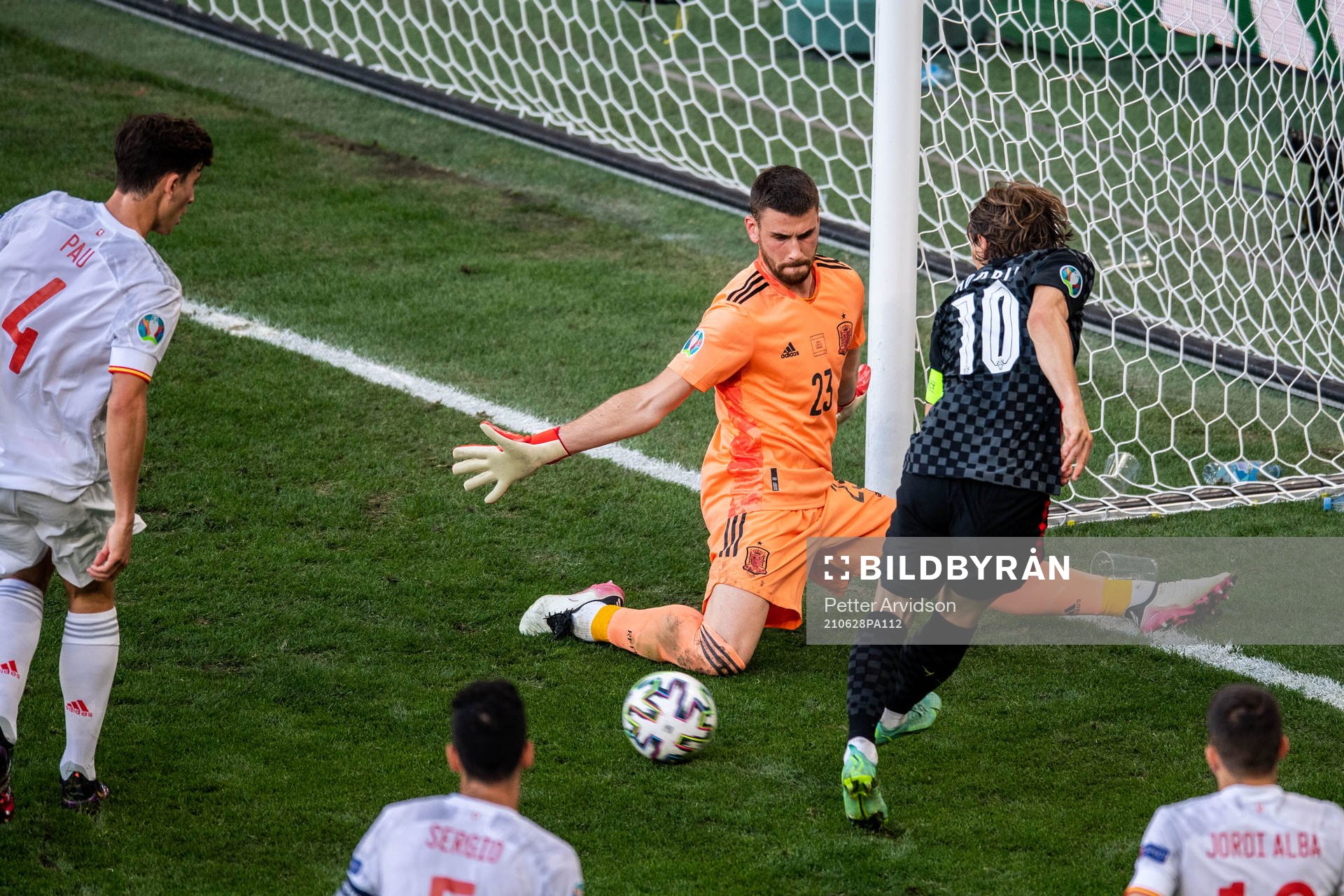 Goalkeeper Unai Simon of Spain and Luka Modric of Croatia