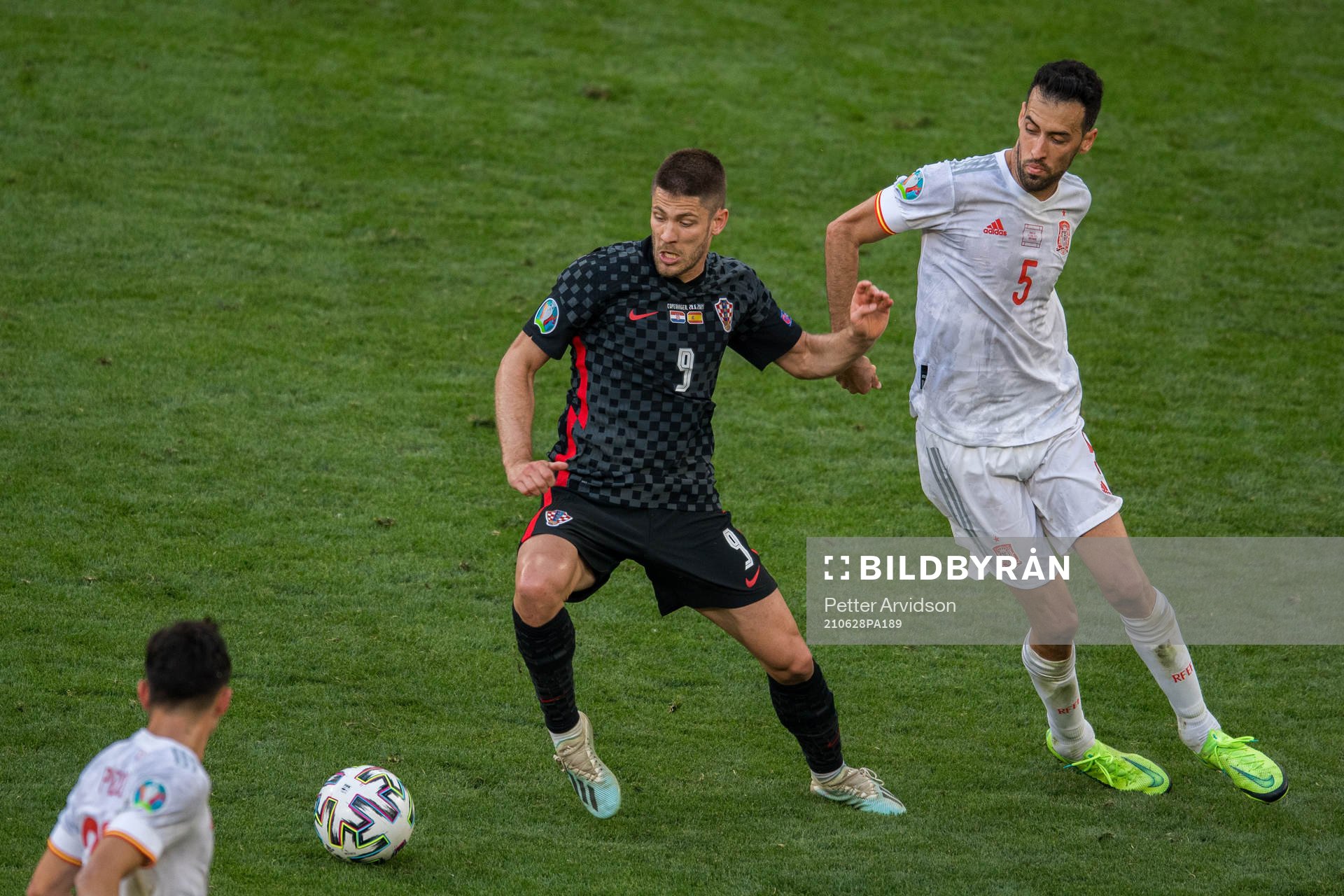 Andrej Kramaric of Croatia and Sergio Busquets of Spain