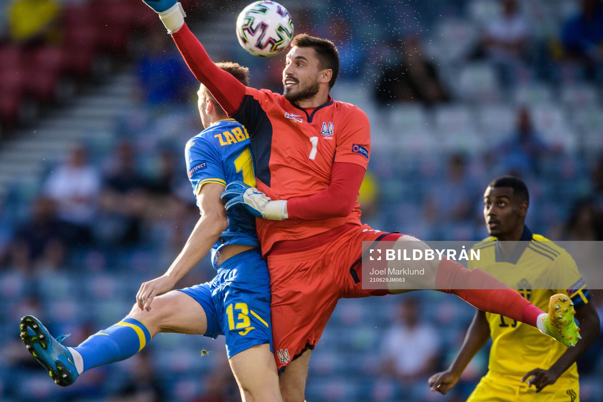 Illia Zabarnyi and goalkeeper Georgiy Bushchan of Ukraine