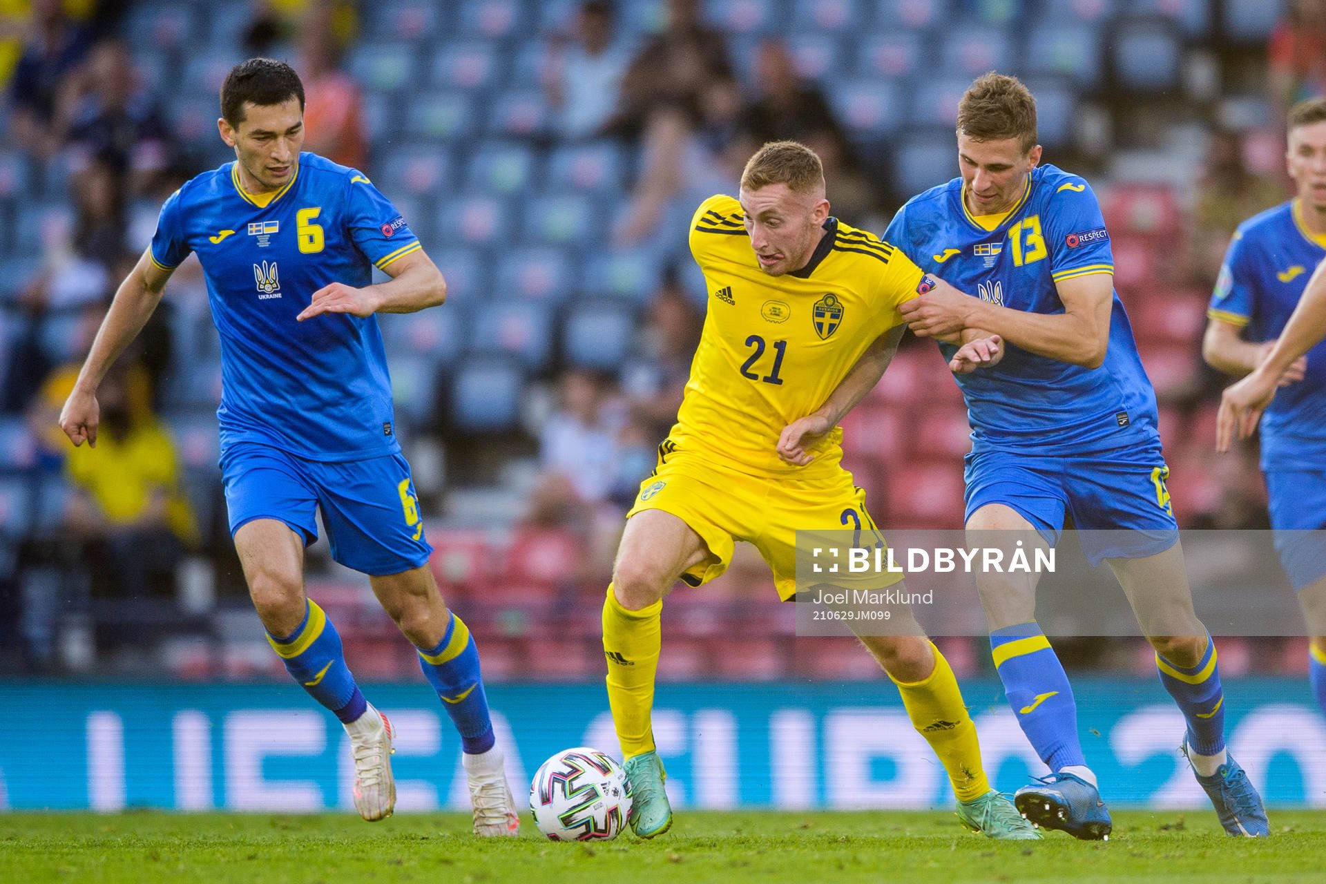 Taras Stepanenko and Illia Zabarnyi of Ukraine against Dejan Kulusevski of Sweden during the UEFA Euro 2020 Football Championship round of 16 match between Sweden and Ukraina on June 29, 2021 in Glasgow.