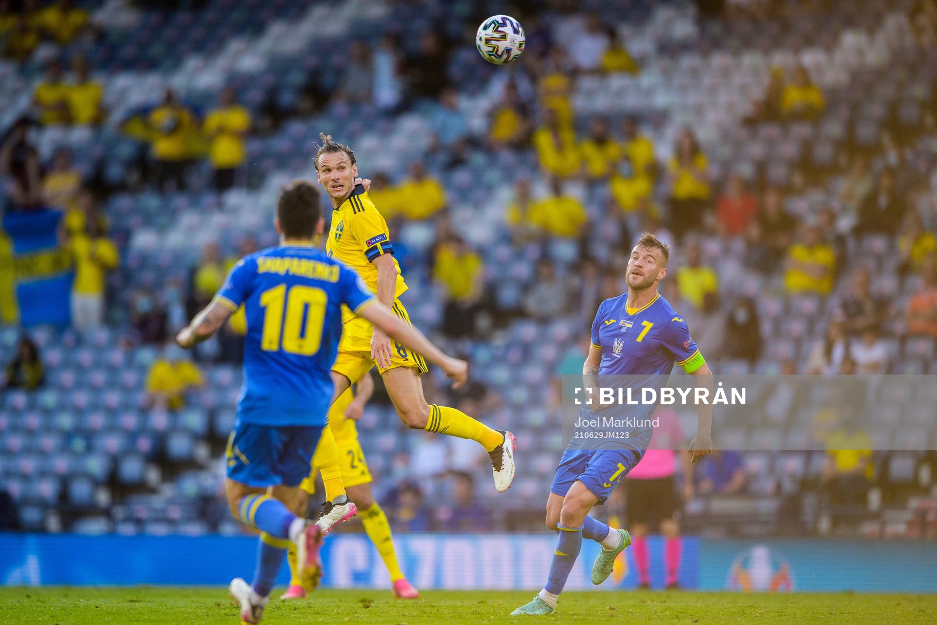 Albin Ekdal of Sweden and Andriy Yarmolenko of Ukraine
