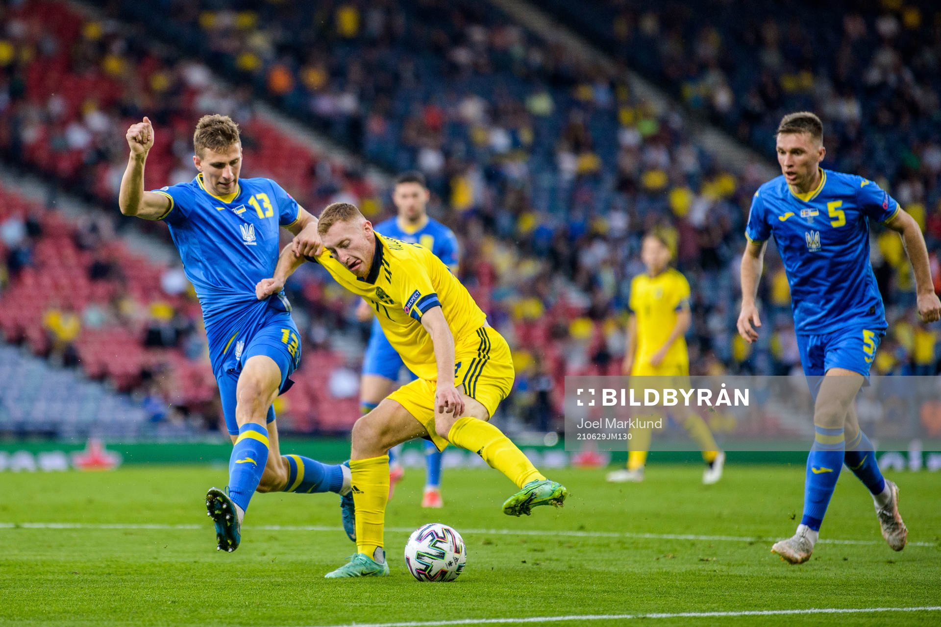 Illia Zabarnyi of Ukraine against Dejan Kulusevski of Sweden