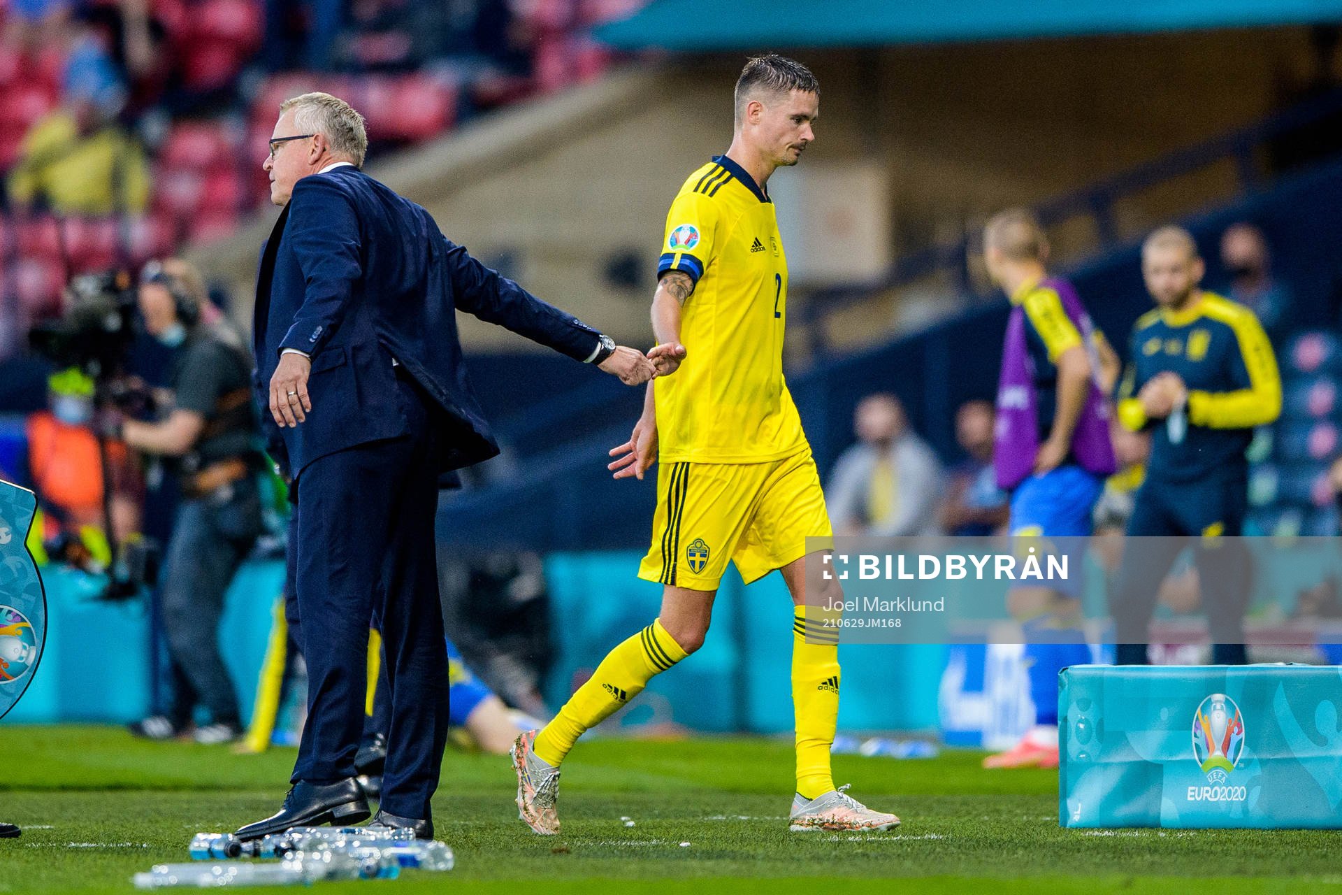 head coach Janne Andersson and Mikael Lustig of Sweden