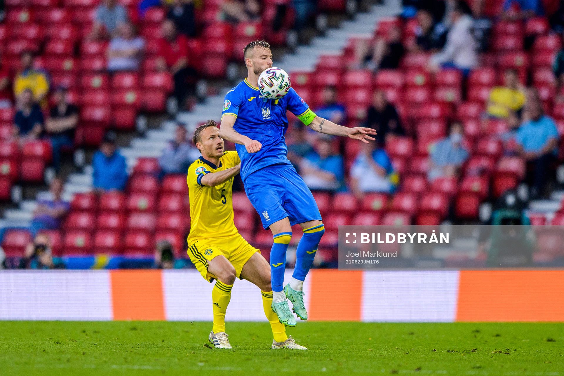 Pierre Bengtsson of Sweden and Andriy Yarmolenko of Ukraine