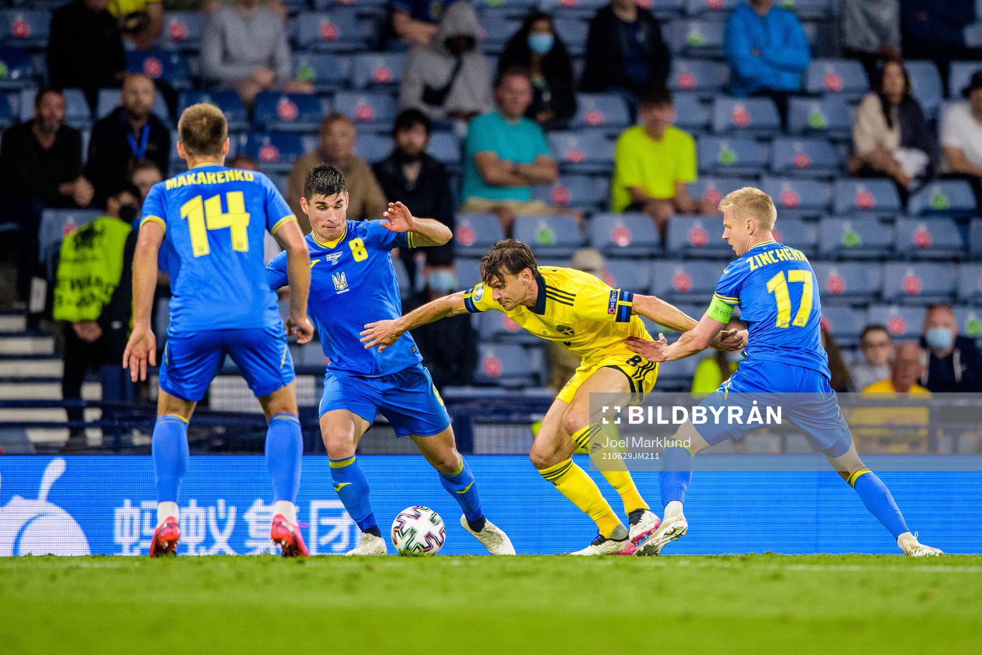 Ruslan Malinovskyi and Oleksandr Zinchenko of Ukraine against Albin Ekdal of Sweden during the UEFA Euro 2020 Football Championship round of 16 match between Sweden and Ukraina on June 29, 2021 in Glasgow.
