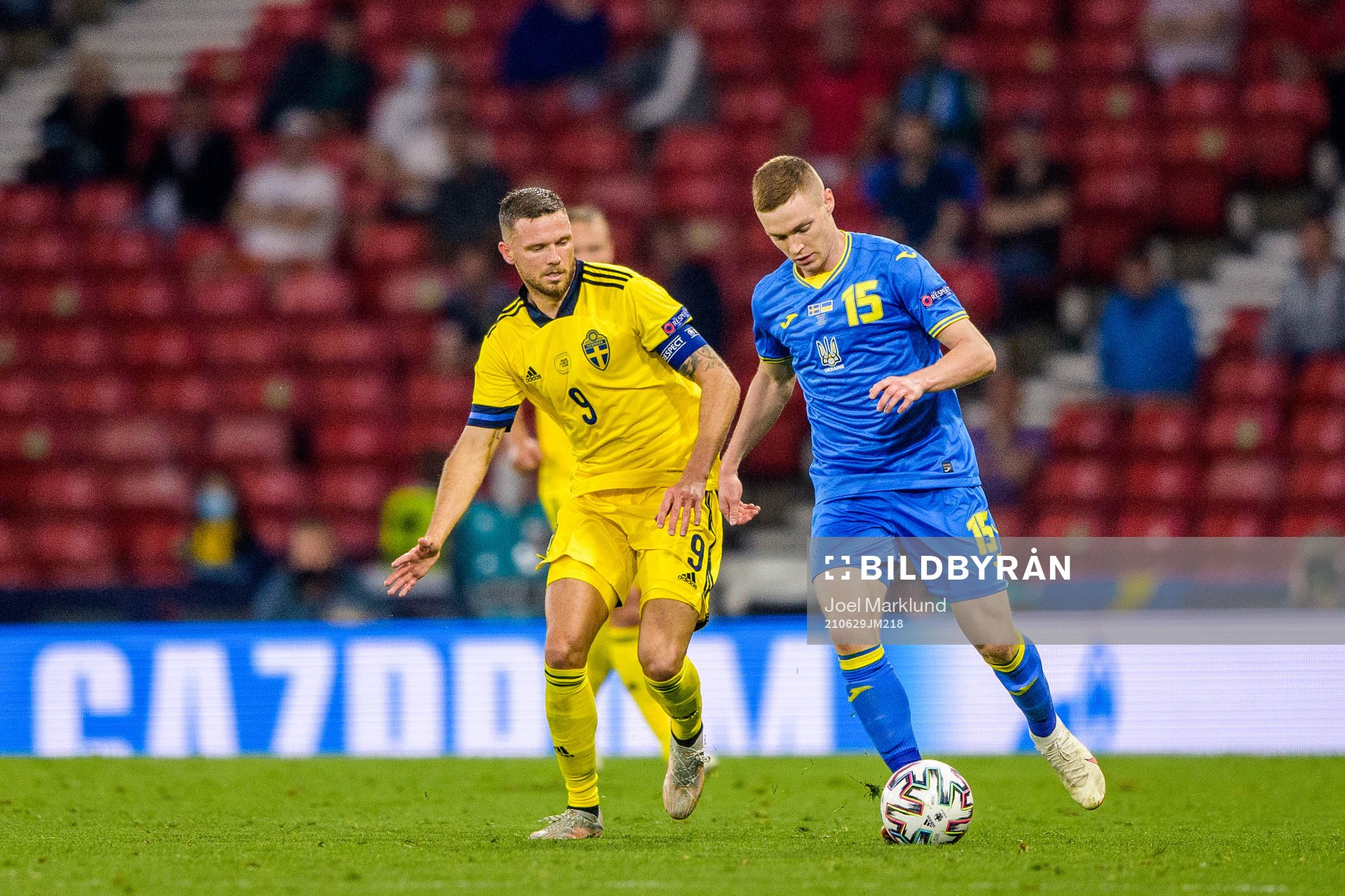 Marcus Berg of Sweden and Viktor Tsygankov of Ukraine