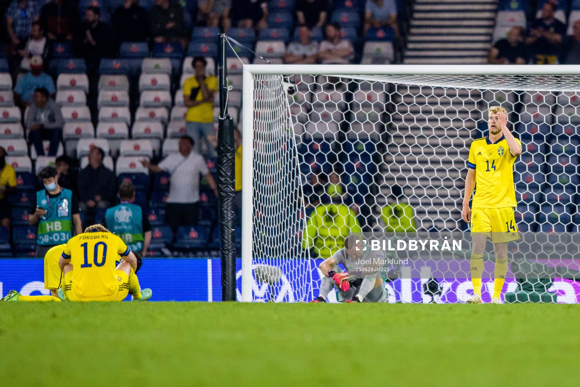 goalkeeper Robin Olsen and Filip Helander of Sweden looks