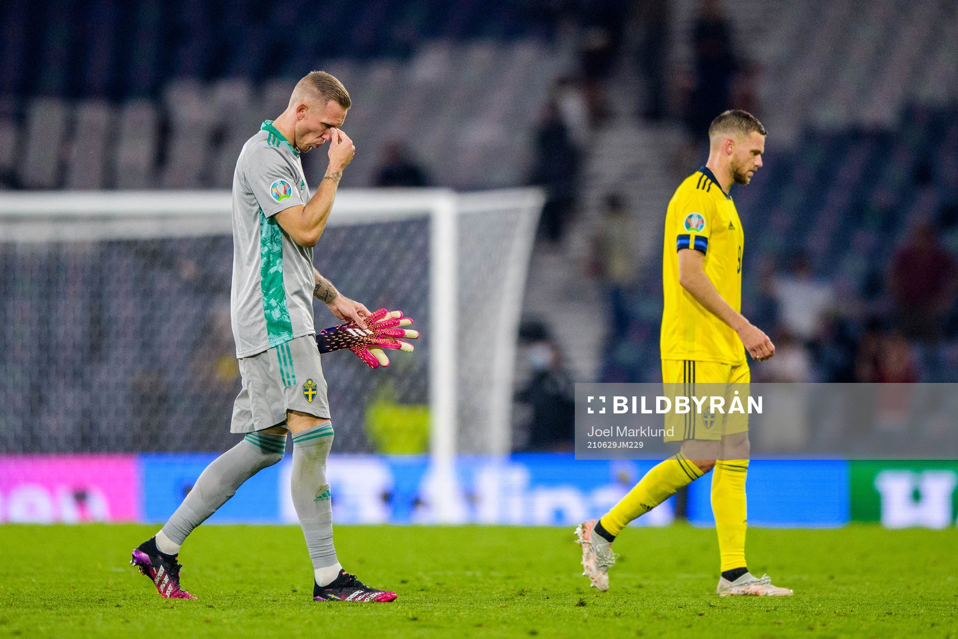 goalkeeper Robin Olsen and Marcus Berg of Sweden look