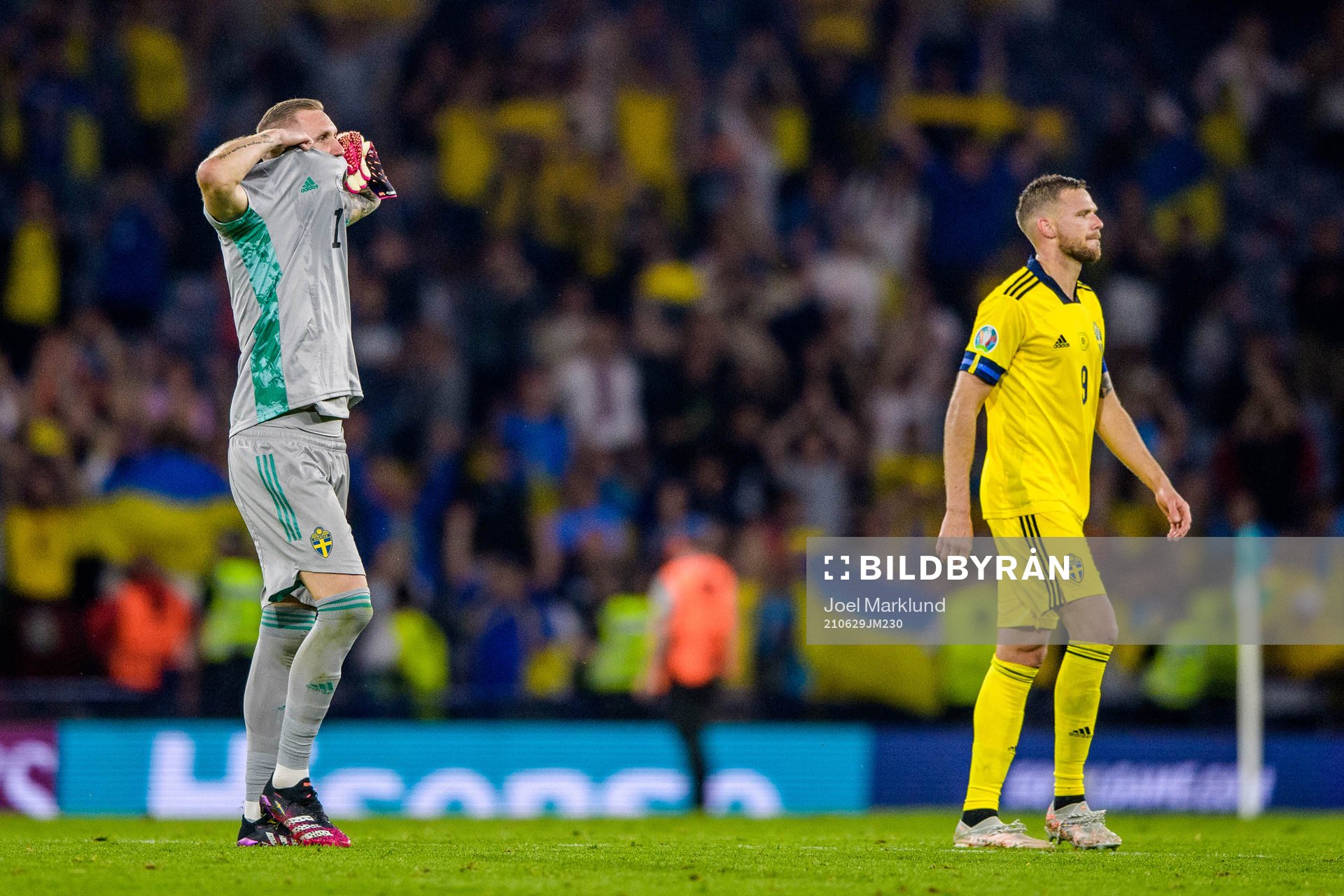 goalkeeper Robin Olsen and Marcus Berg of Sweden look