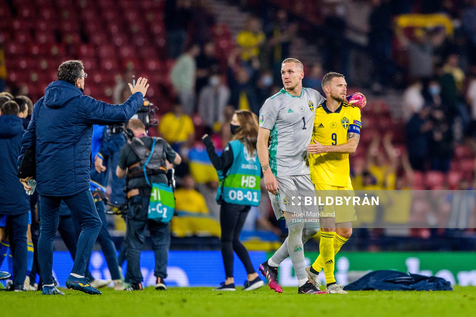 goalkeeper Robin Olsen and Marcus Berg of Sweden look