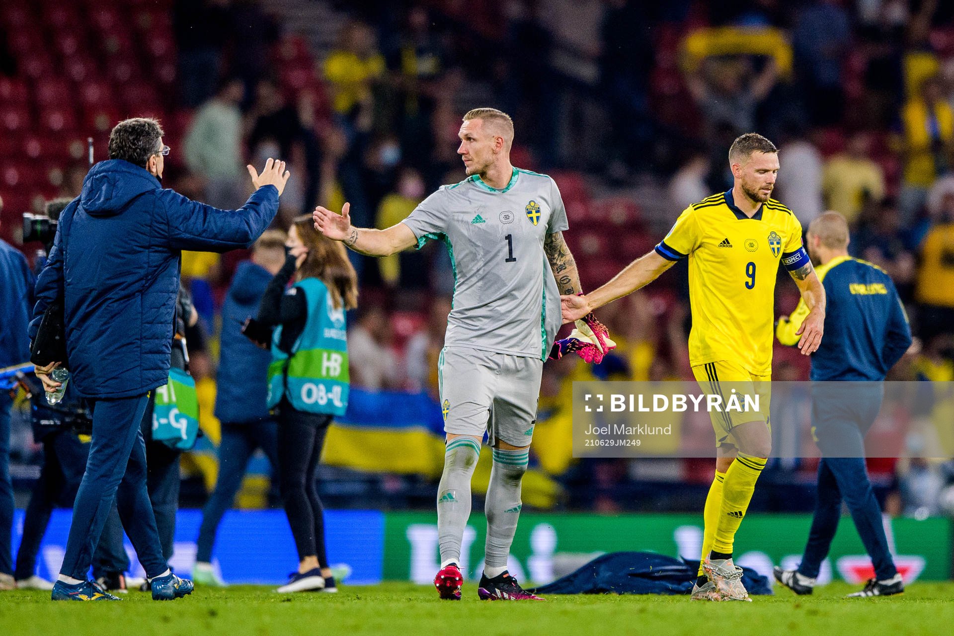 goalkeeper Robin Olsen and Marcus Berg of Sweden look