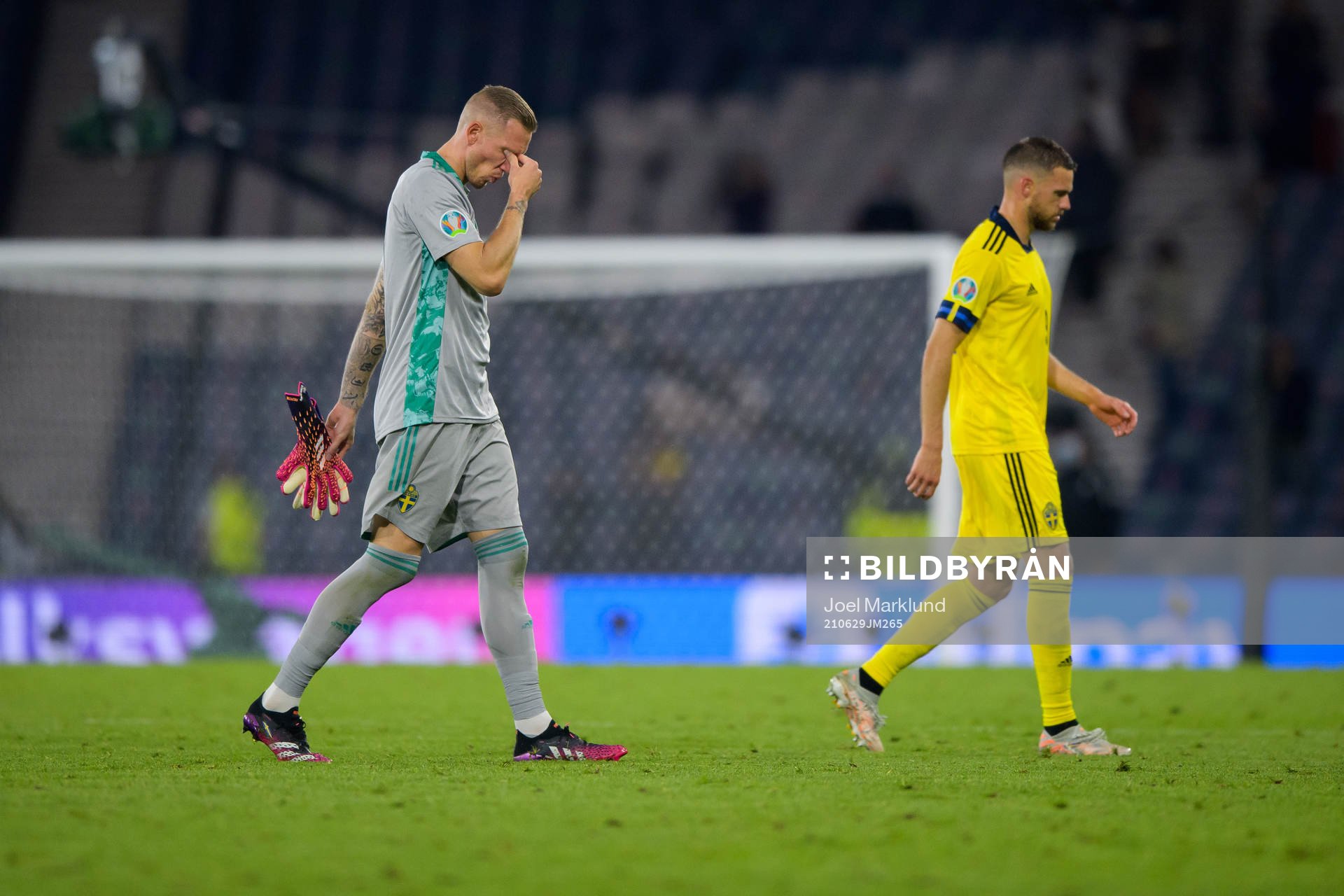 Goalkeeper Robin Olsen and Marcus Berg of Sweden look