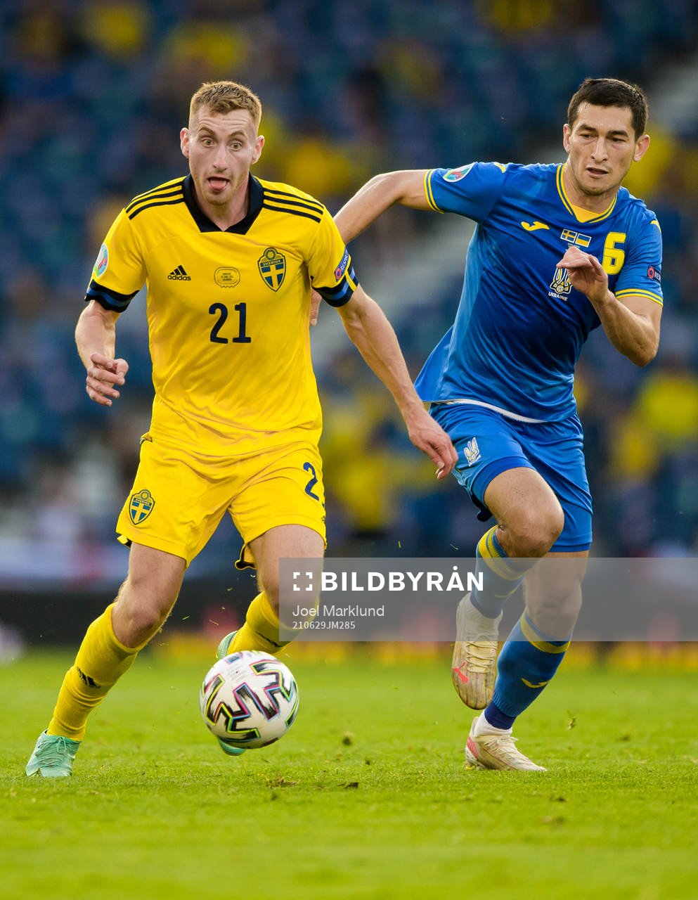Dejan Kulusevski of Sweden and Taras Stepanenko of Ukraine
