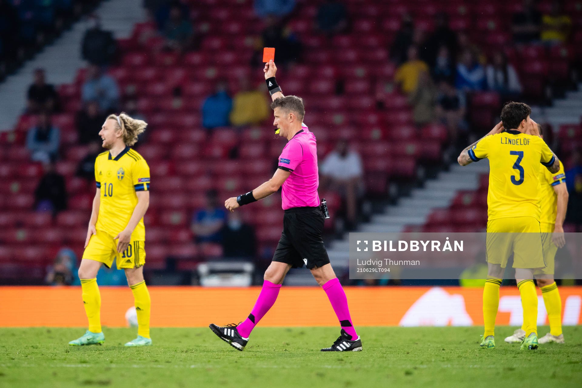 Marcus Danielson (not in picture) of Sweden gets a red card