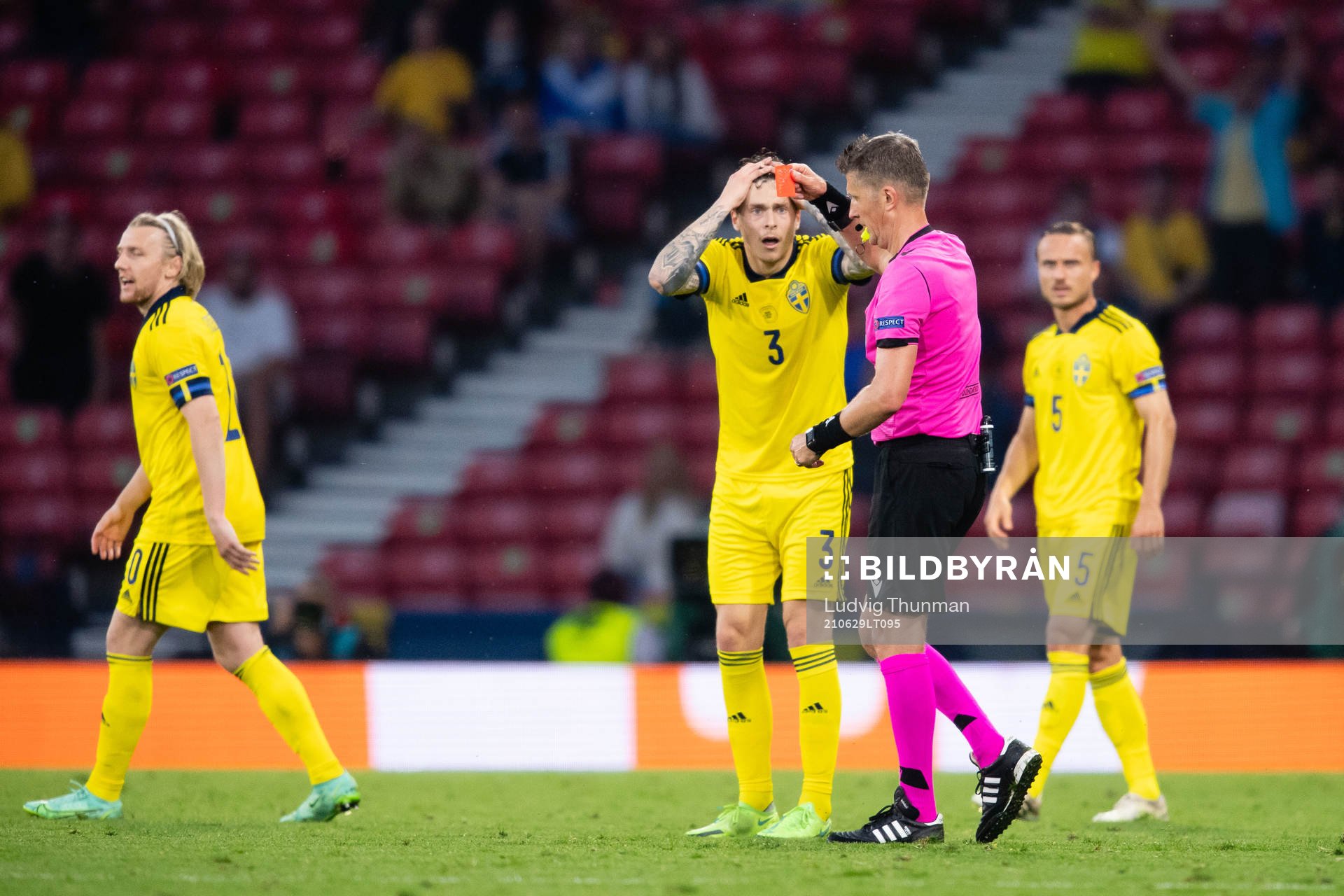 Marcus Danielson (not in picture) of Sweden gets a red card