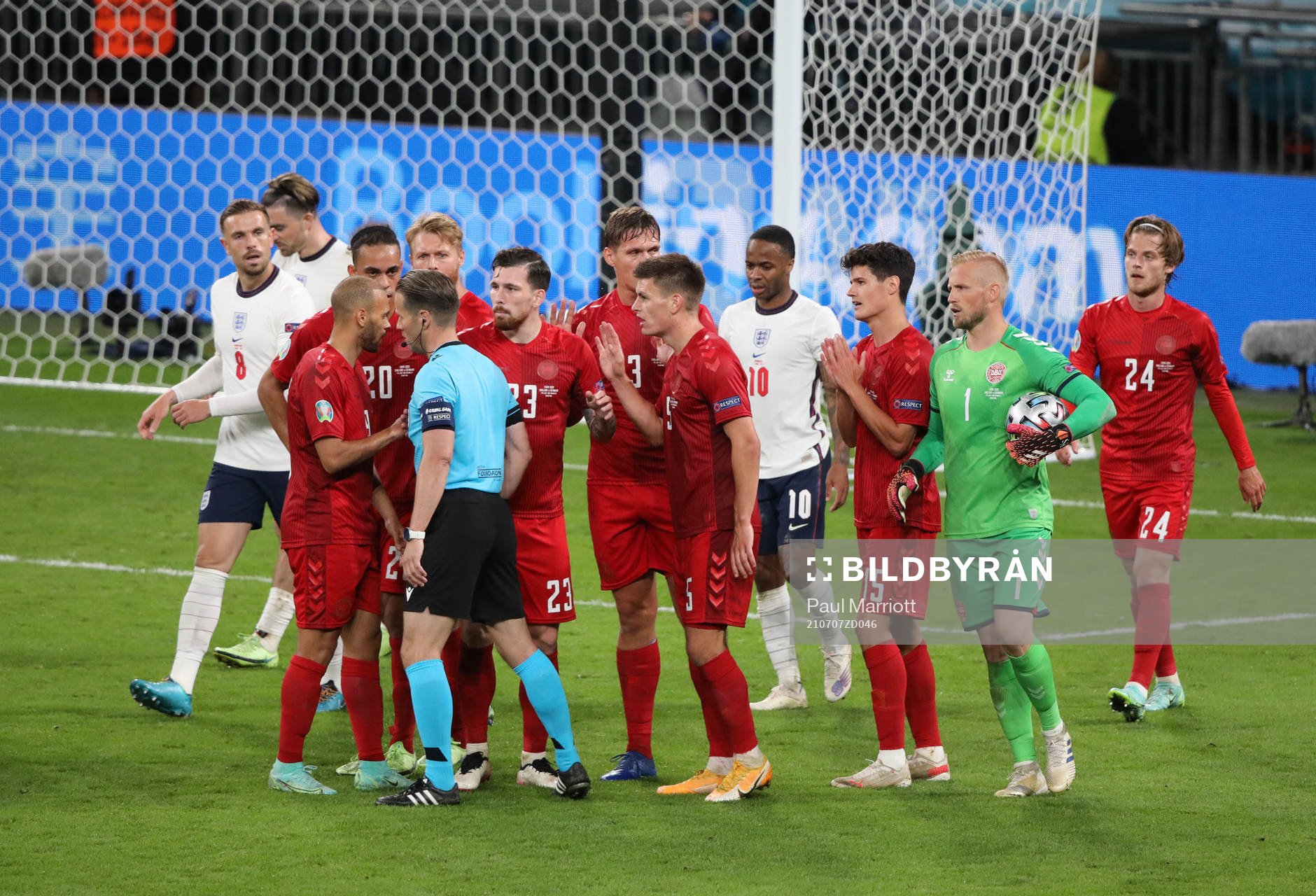 Players of Denmark protest about the penalty decision