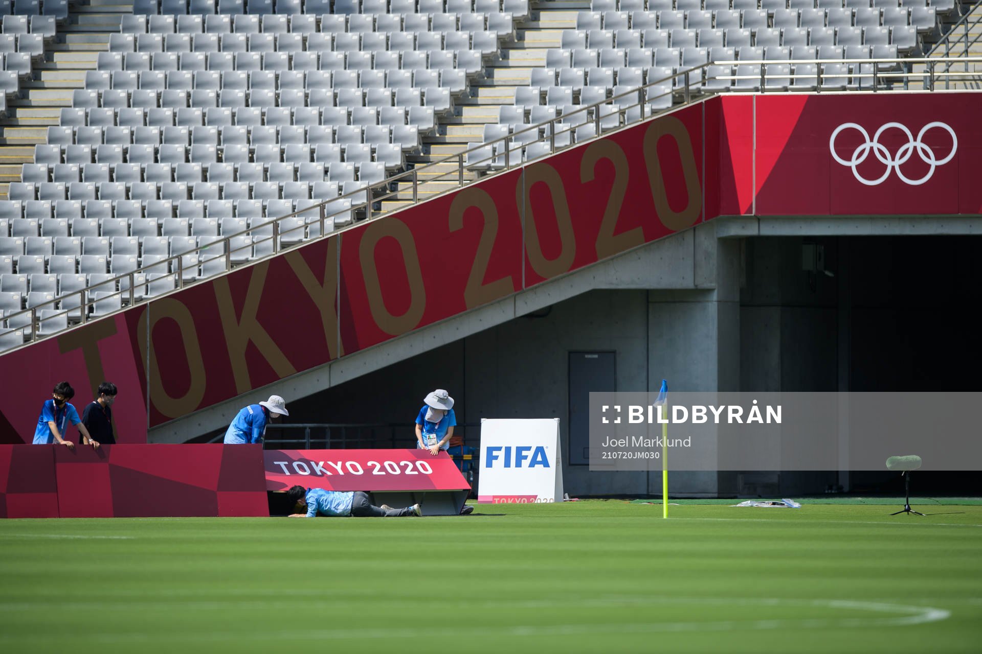 Crew adjust boards at Tokyo Stadium