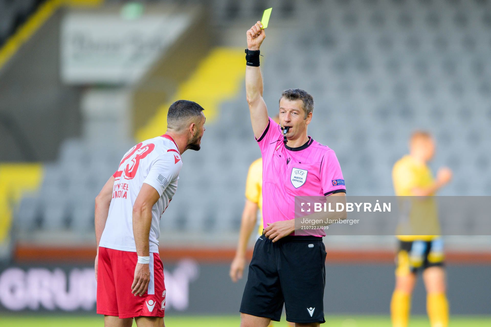 Vadim Bolohan of Milsami Orheis receives a yellow card from