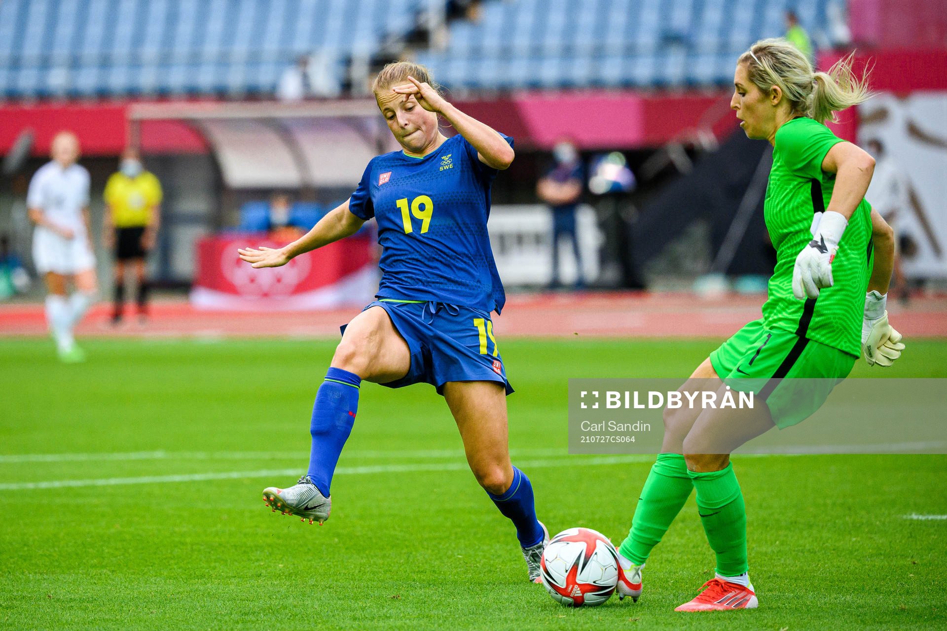 Anna Anvegård of Sweden and goalkeeper Erin Nayler of New