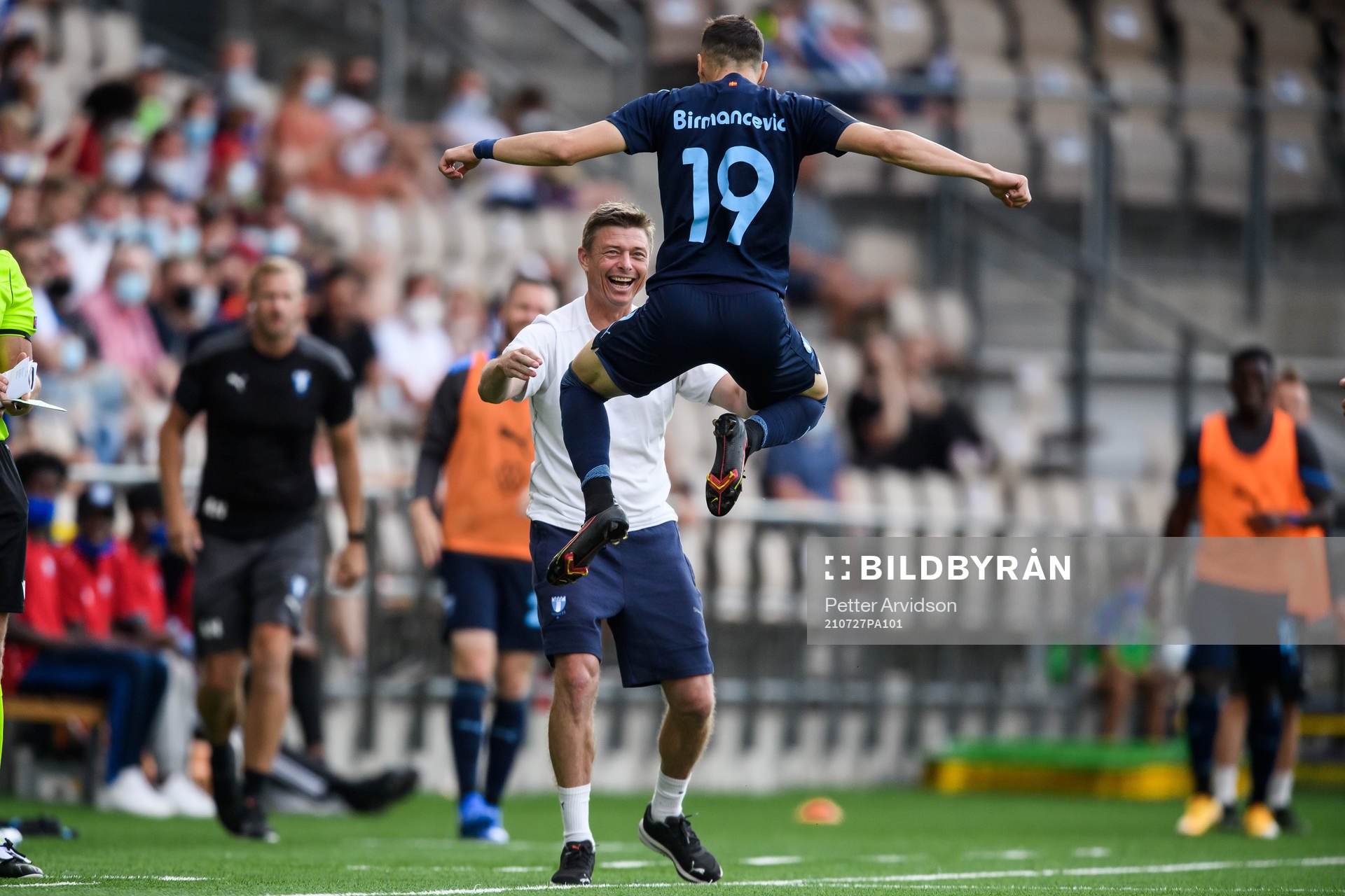 Veljko Birmancevic of Malmö FF celebrate together with Jon Dahl Tomasson, head coach, after scoring 1-2 during the UEFA Champions League qualifying match between HJK Helsinki and Malmö FF on July 27, 2021 in Helsinki.