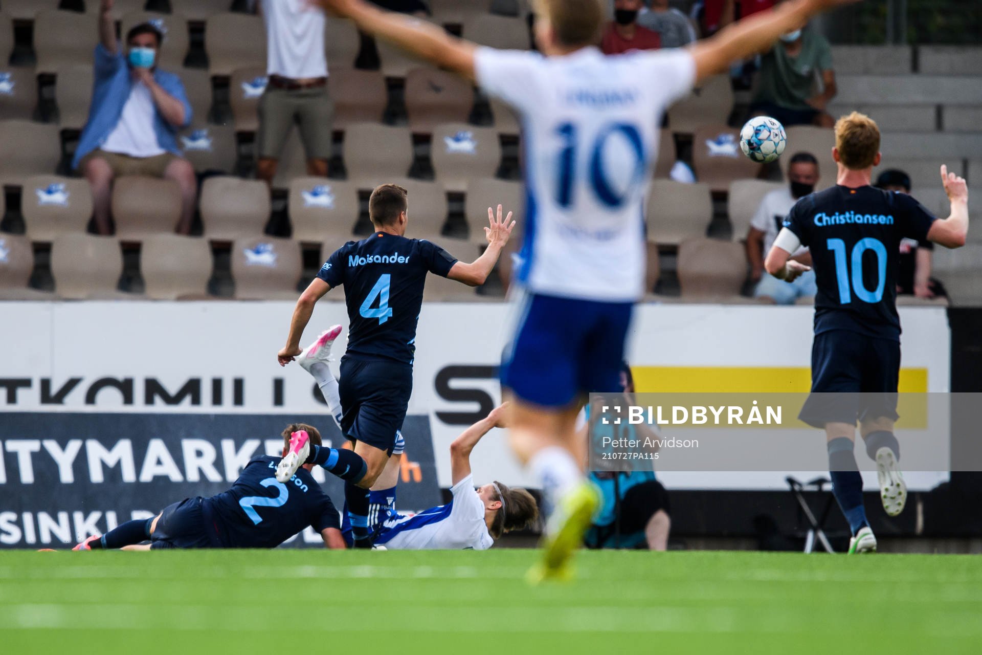 Riku Riski of Helsinki and Eric Larsson of Malmö FF during the UEFA Champions League qualifying match between HJK Helsinki and Malmö FF on July 27, 2021 in Helsinki.