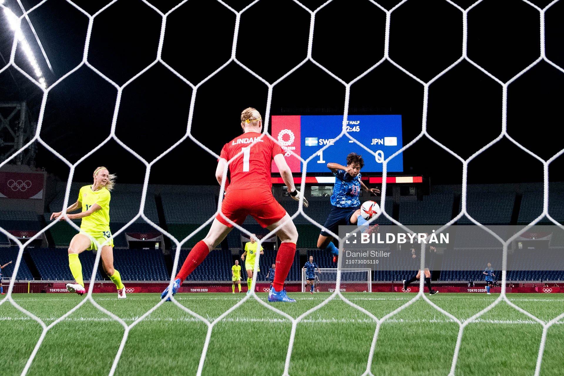 Mina Tanaka of Japan scores 1-1 in the women's football