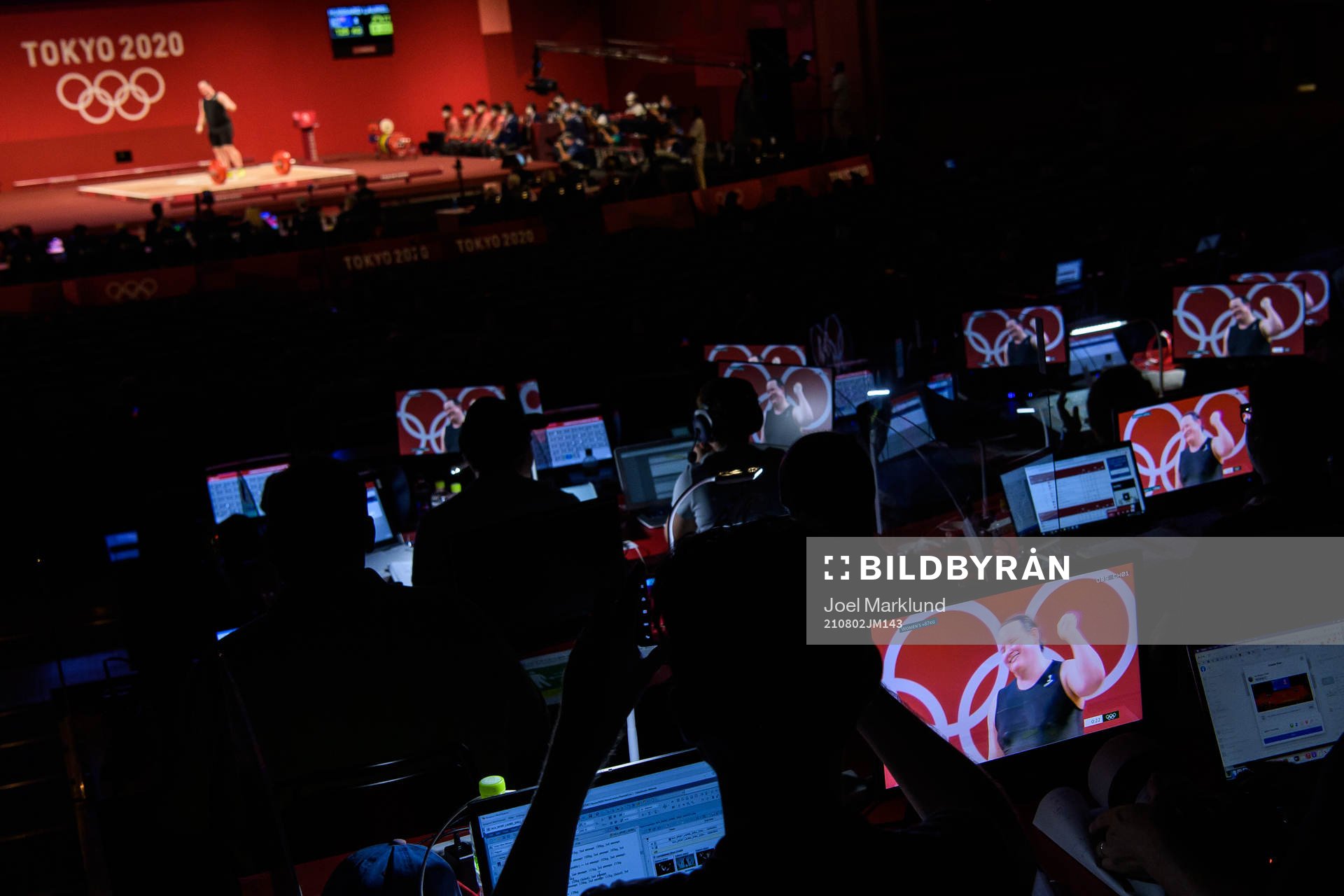 Laurel Hubbard of New Zealand is seen on stage and on journalists monitors when she competes in Women's +87kg Group A weightlifting during day 10 of the Tokyo 2020 Olympic Games on August 2, 2021 at Tokyo International Forum in Tokyo, Japan. Hubbard wrote history together with Canadian football player Quinn by becoming the first openly transgender female athletes to compete at the Olympics.