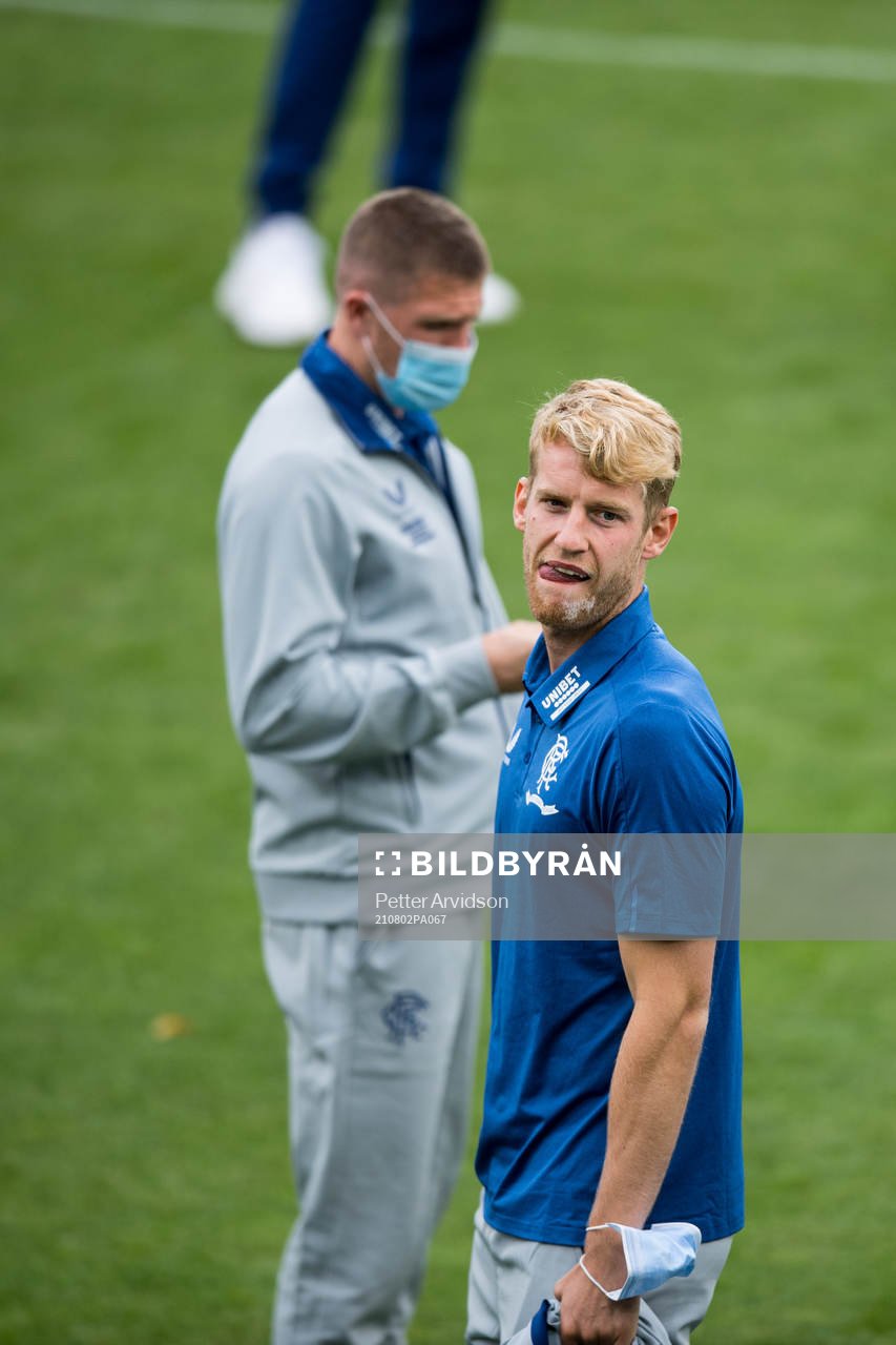 Filip Helander of Rangers inspect the pitch
