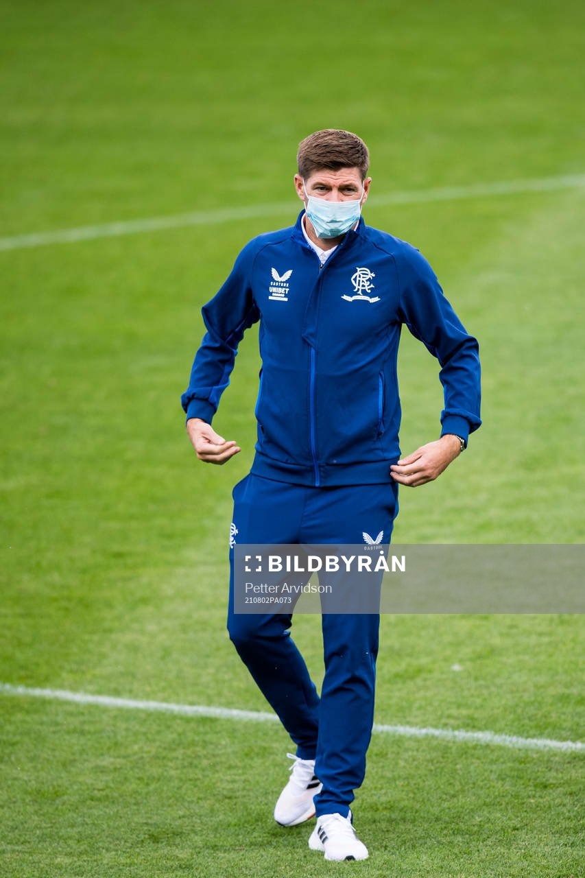 Steven Gerrard, head coach of Rangers inspect the pitch