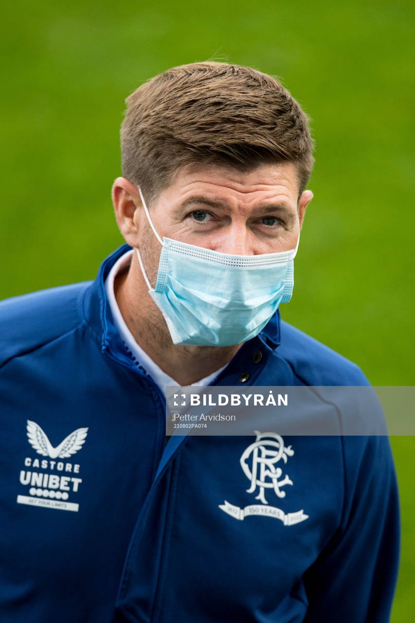 Steven Gerrard, head coach of Rangers inspect the pitch