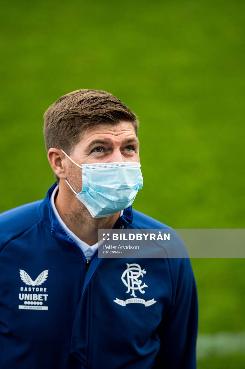 Steven Gerrard, head coach of Rangers inspect the pitch