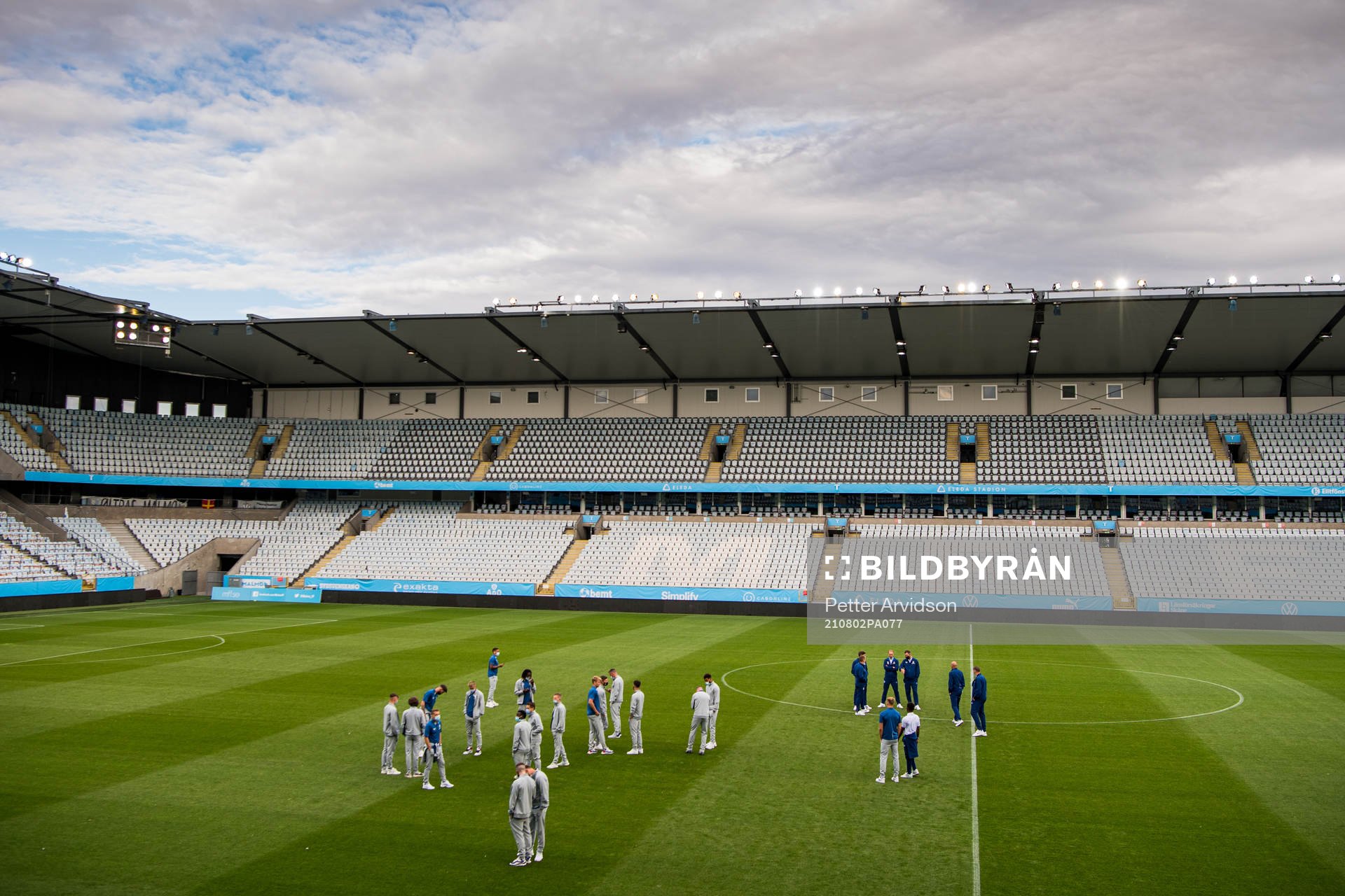 Players of Rangers inspect the pitch