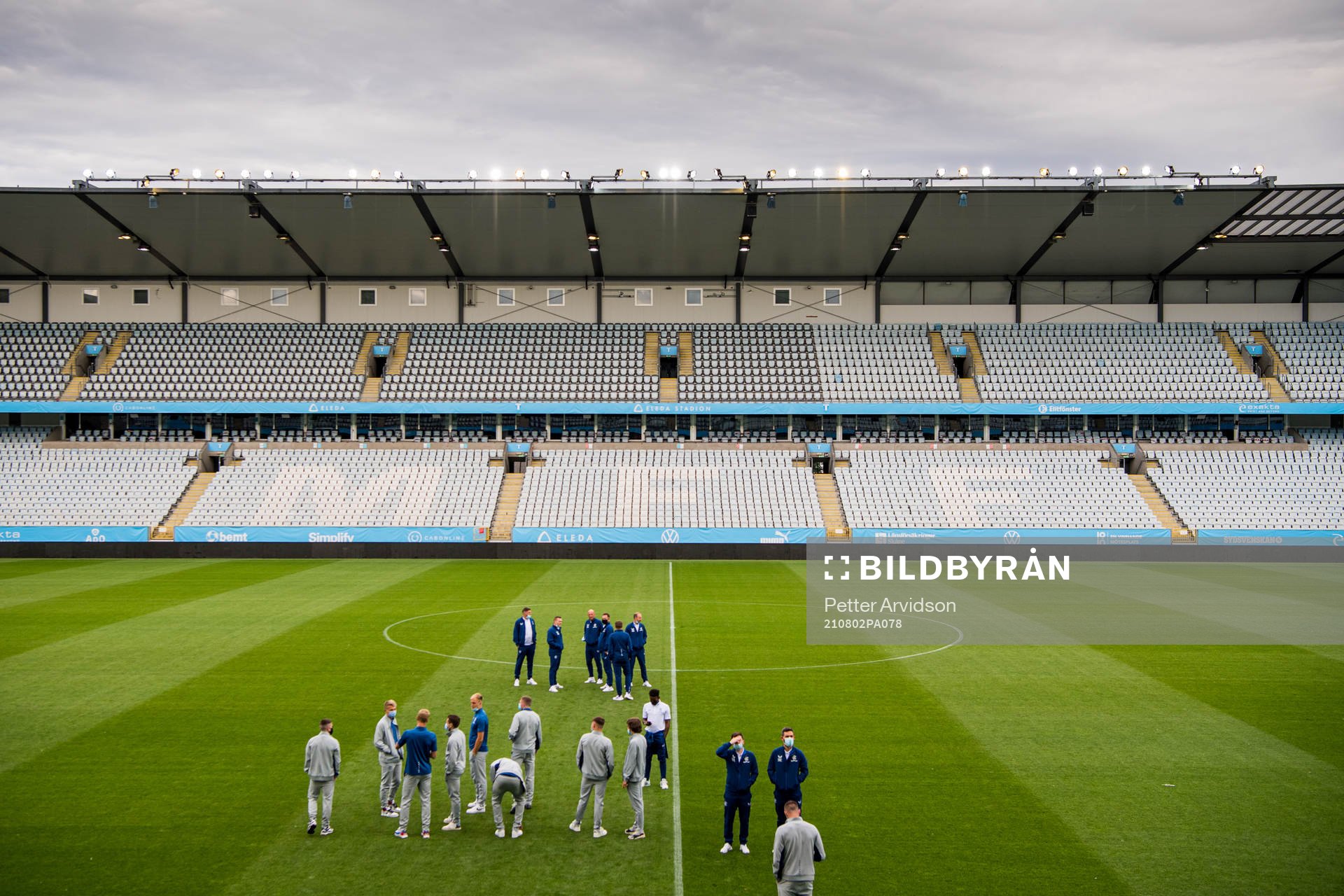 Players of Rangers inspect the pitch