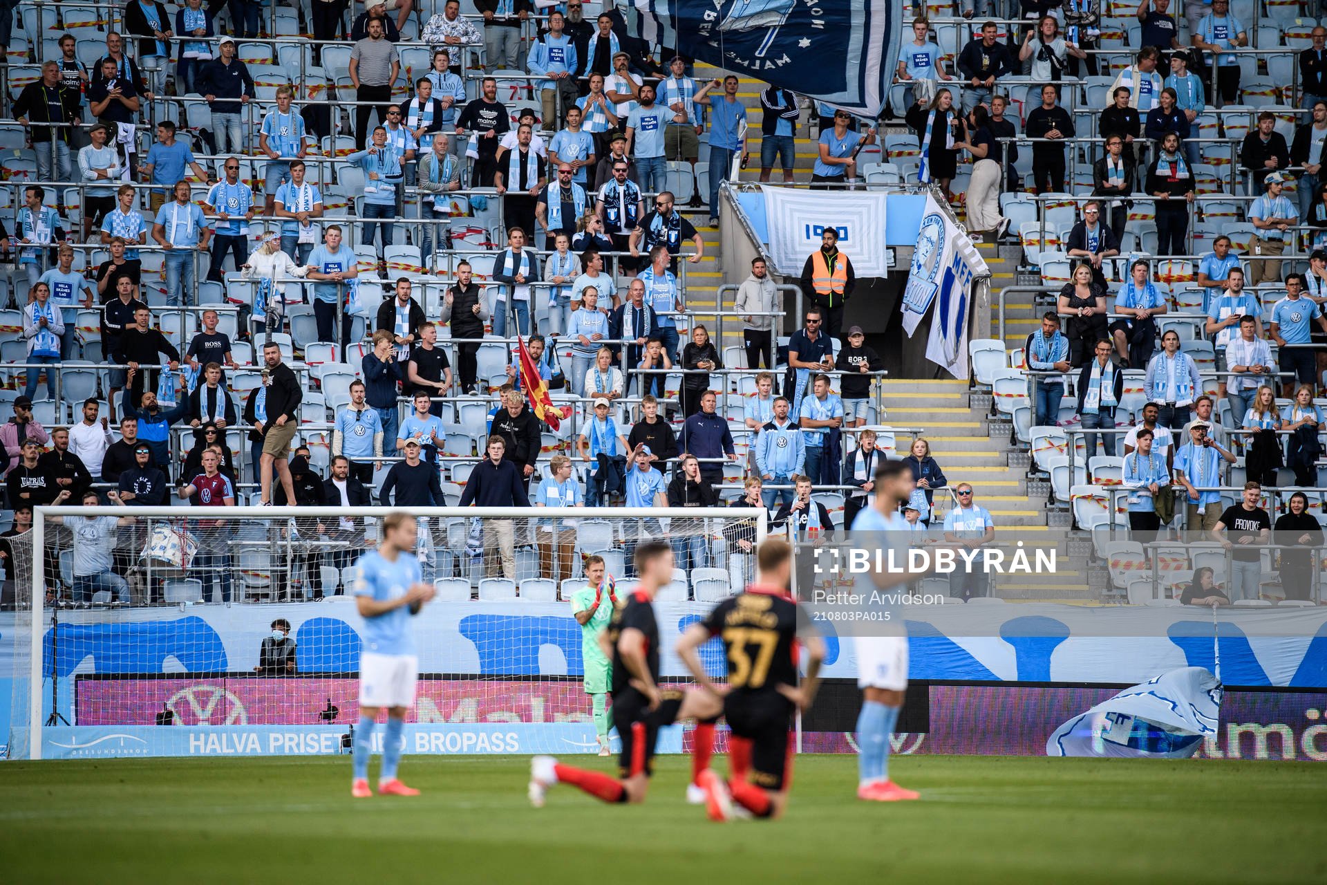 Supporters of Malmö FF react as players of Rangers take a