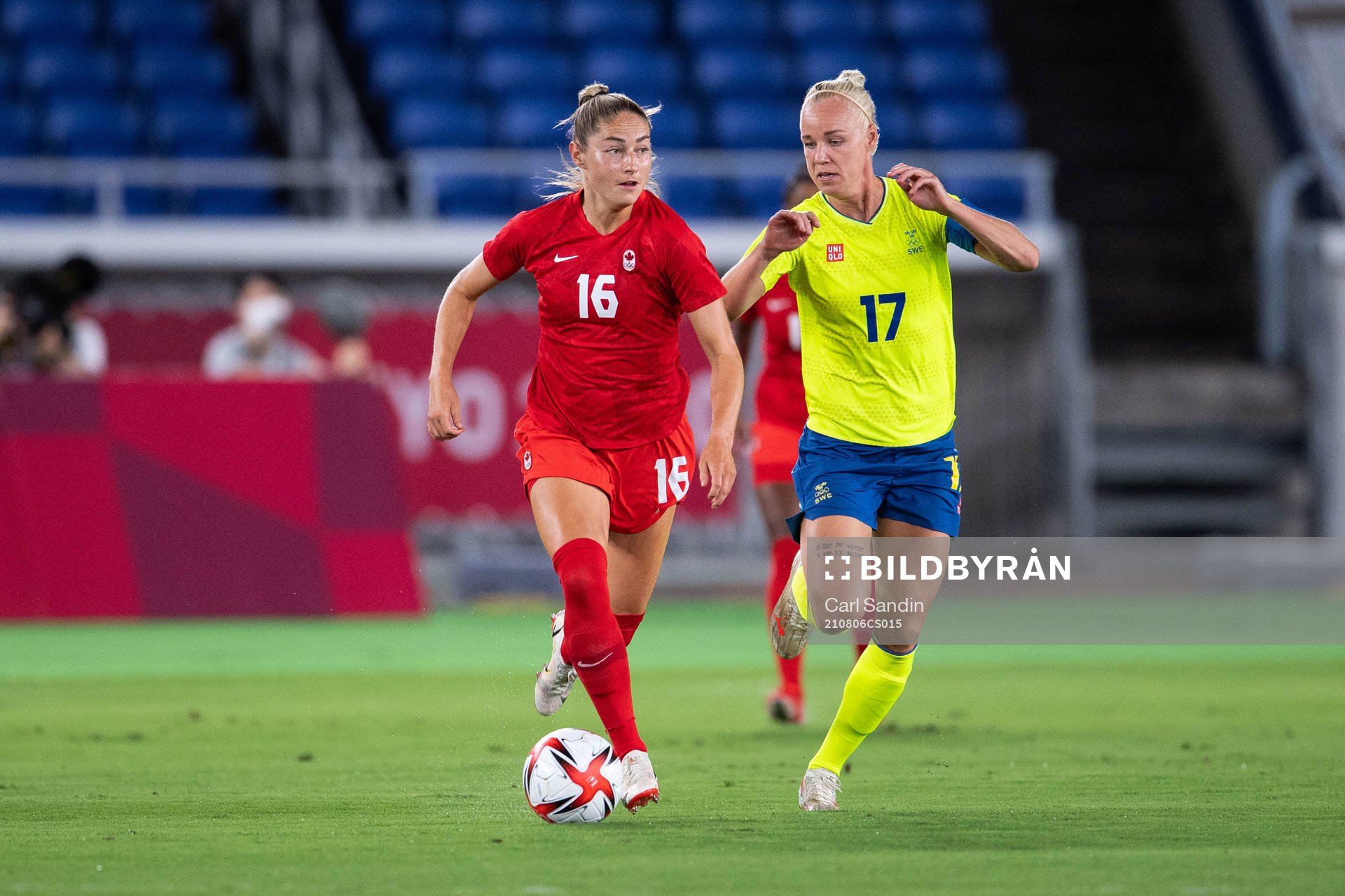Janine Beckie of Canada and Caroline Seger of Sweden in the