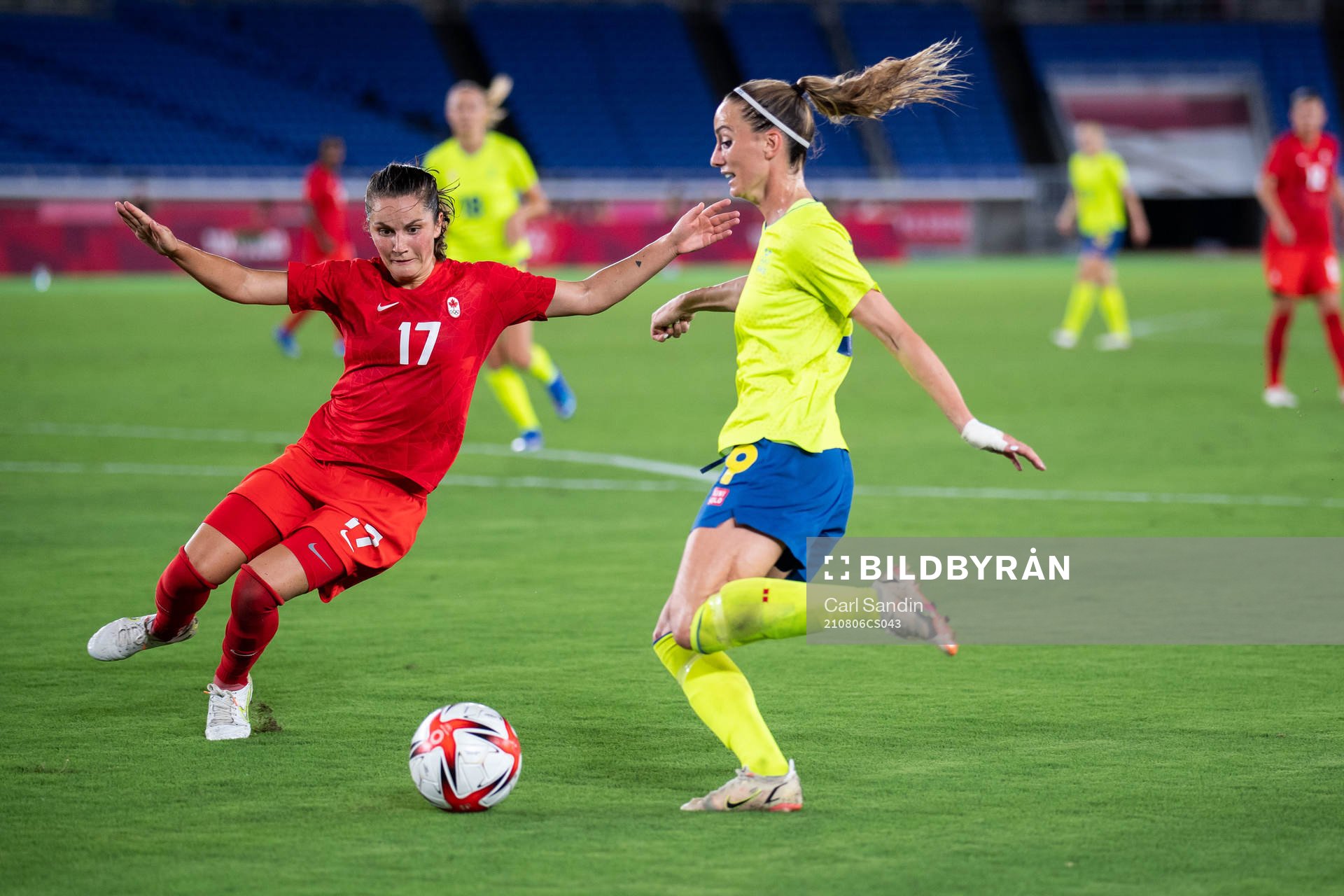 Jessie Fleming of Canada and Kosovare Asllani of Sweden in