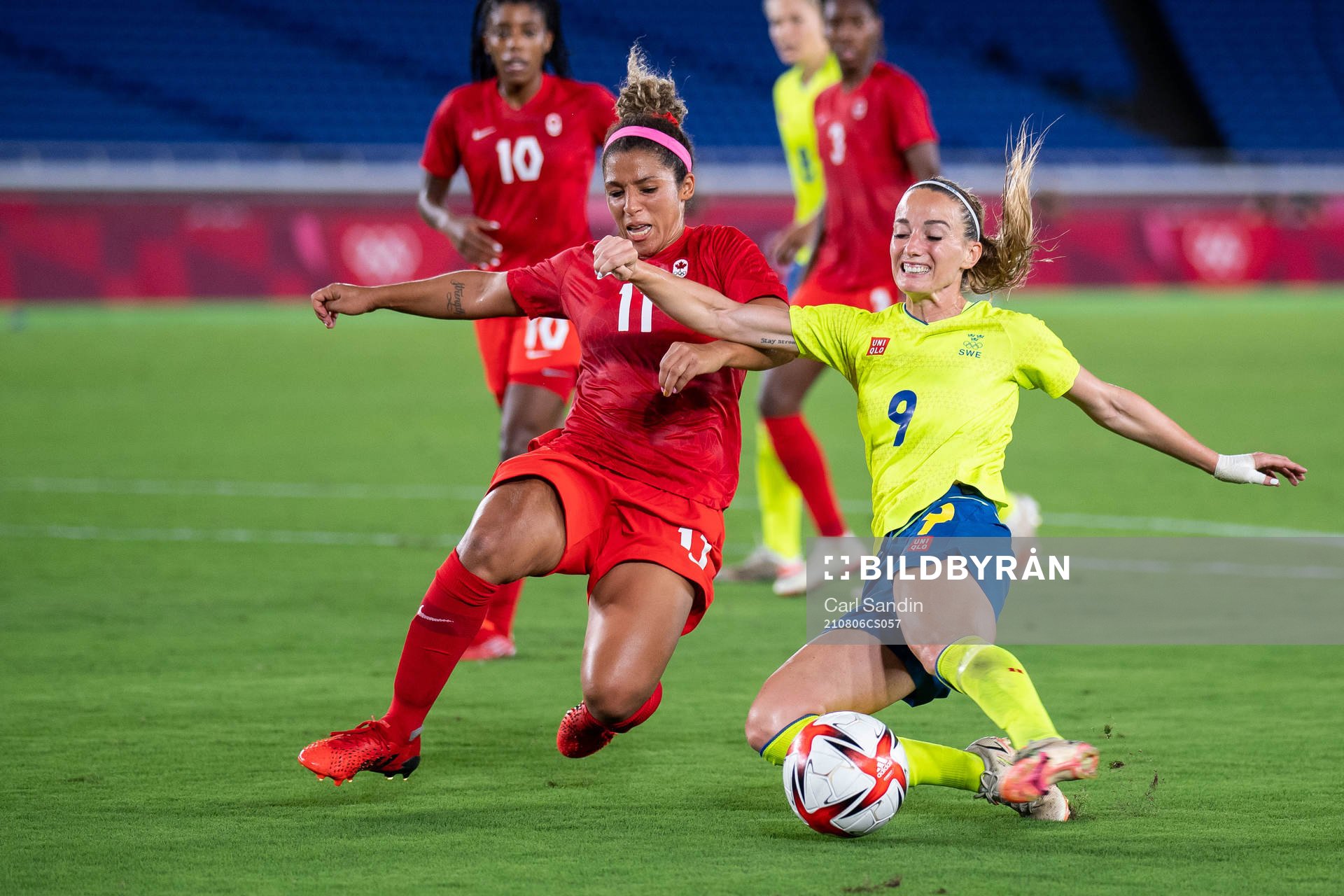 Desiree Scott of Canada and Kosovare Asllani of Sweden in