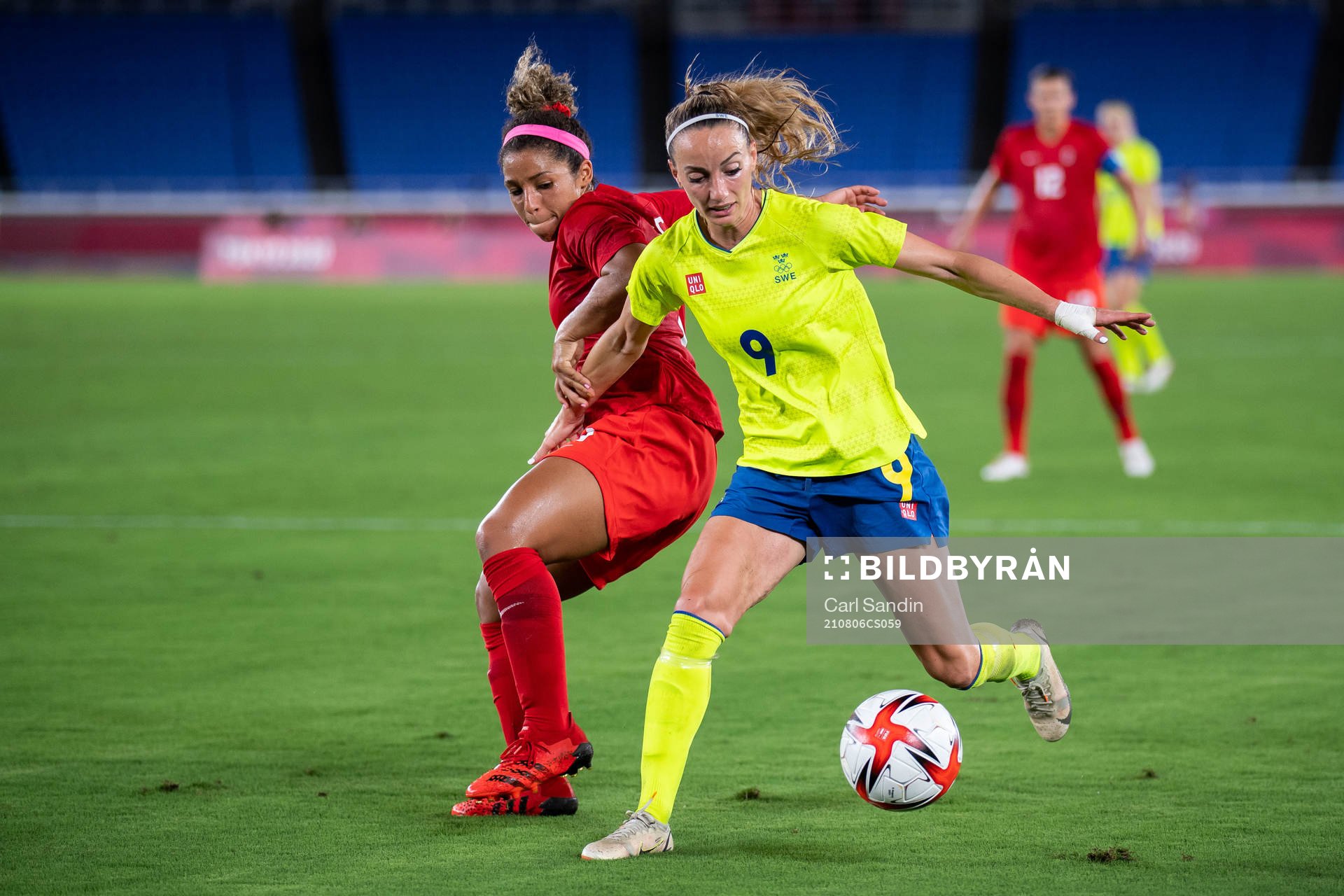 Desiree Scott of Canada and Kosovare Asllani of Sweden in
