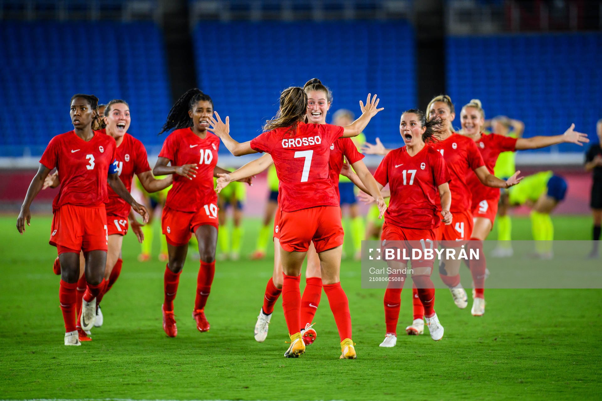 Julia Grosso of Canada celebrates with teammates