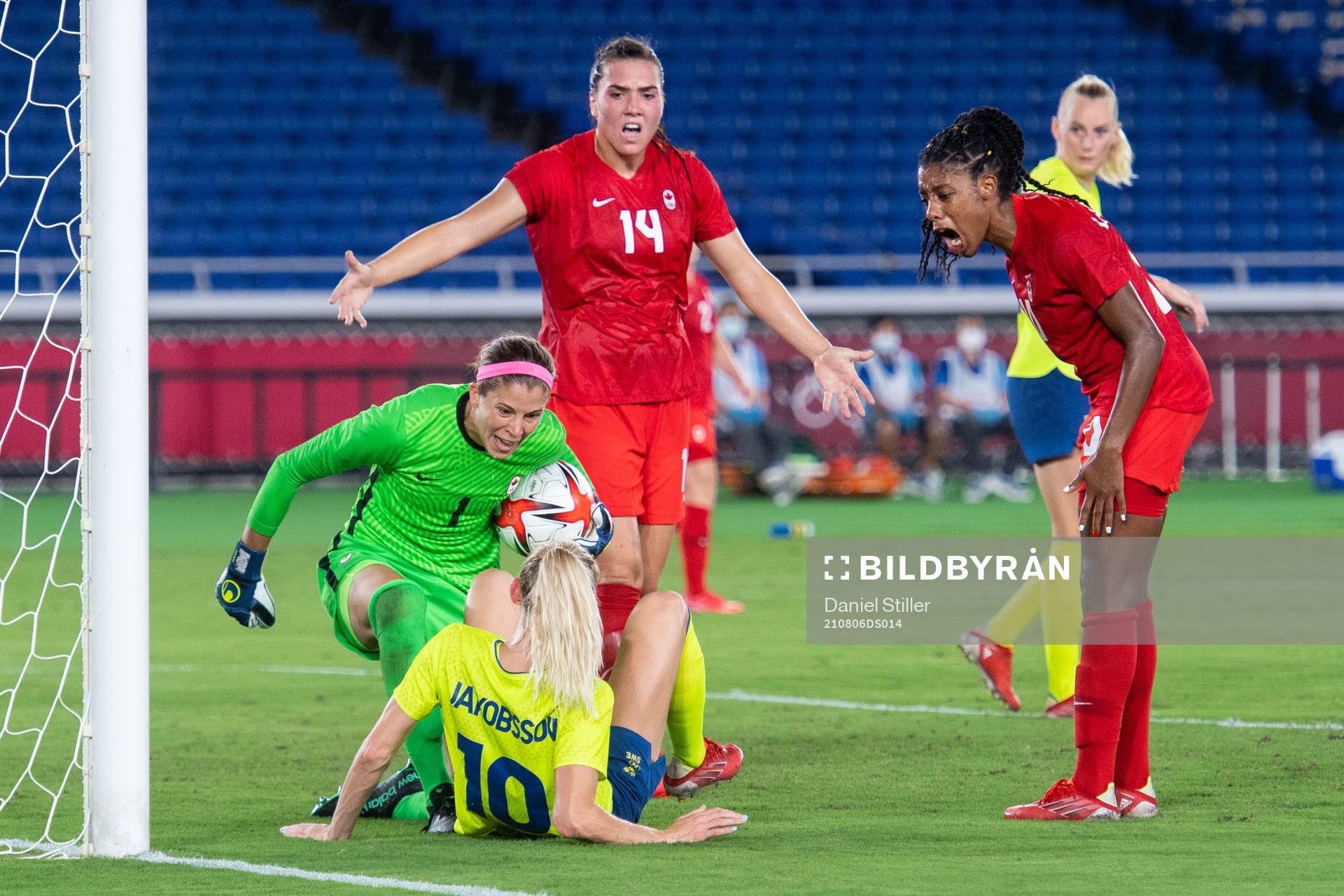 Goalkeeper Stephanie Labbe of Canada and Sofia Jakobsson of