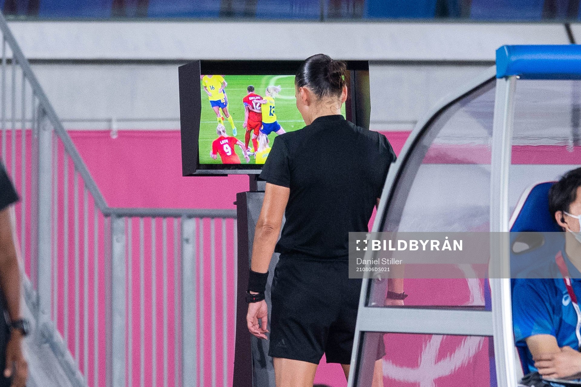Referee Anastasia Pustovoitova looks at a VAR-checkin the