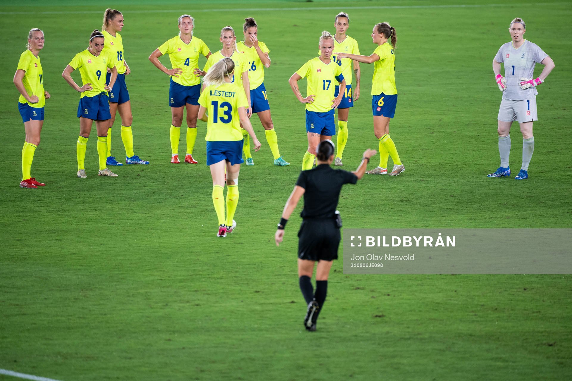 Caroline Seger of Sweden and Referee Anastasia Pustovoitova