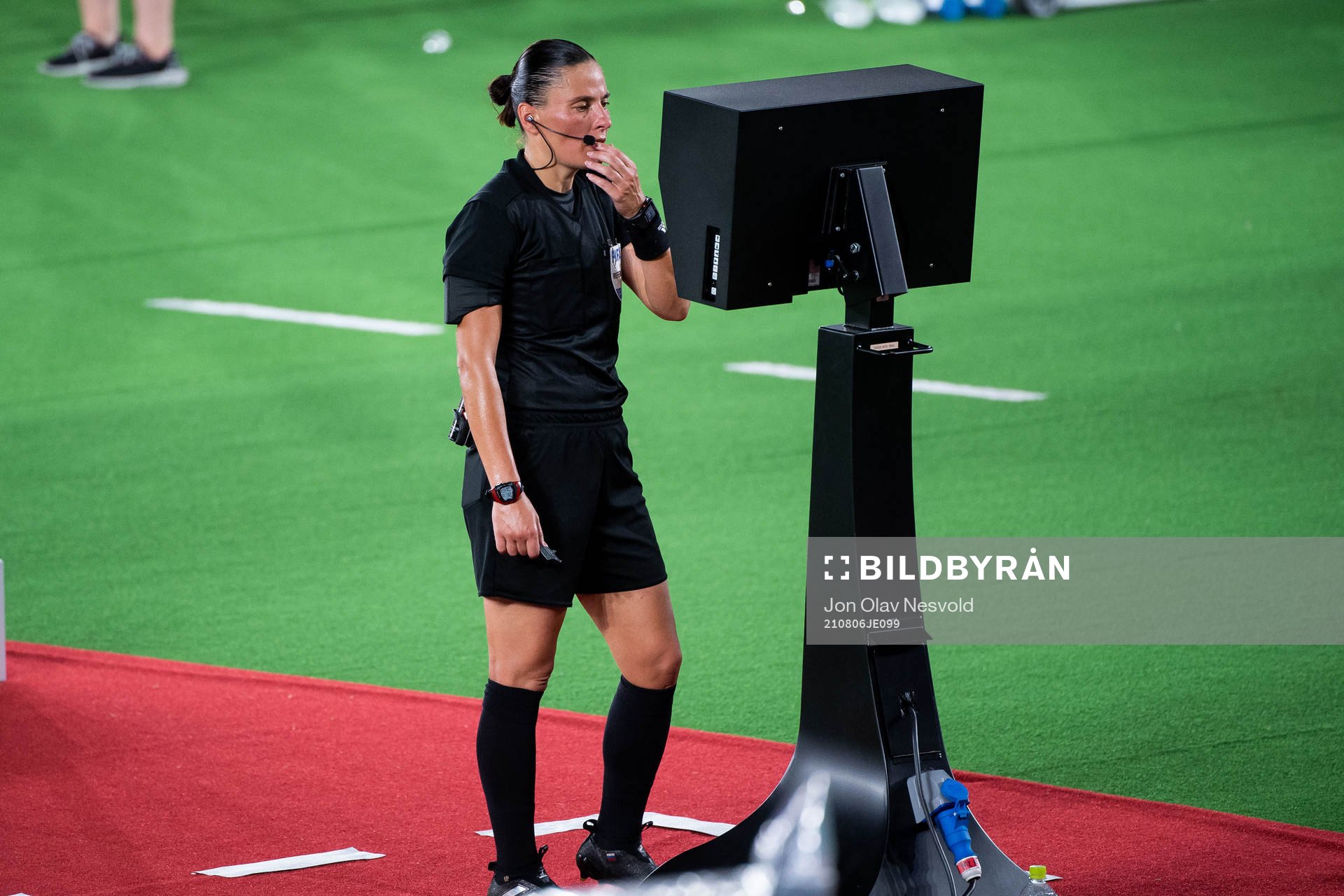 Referee Anastasia Pustovoitova looks at a VAR screen in the