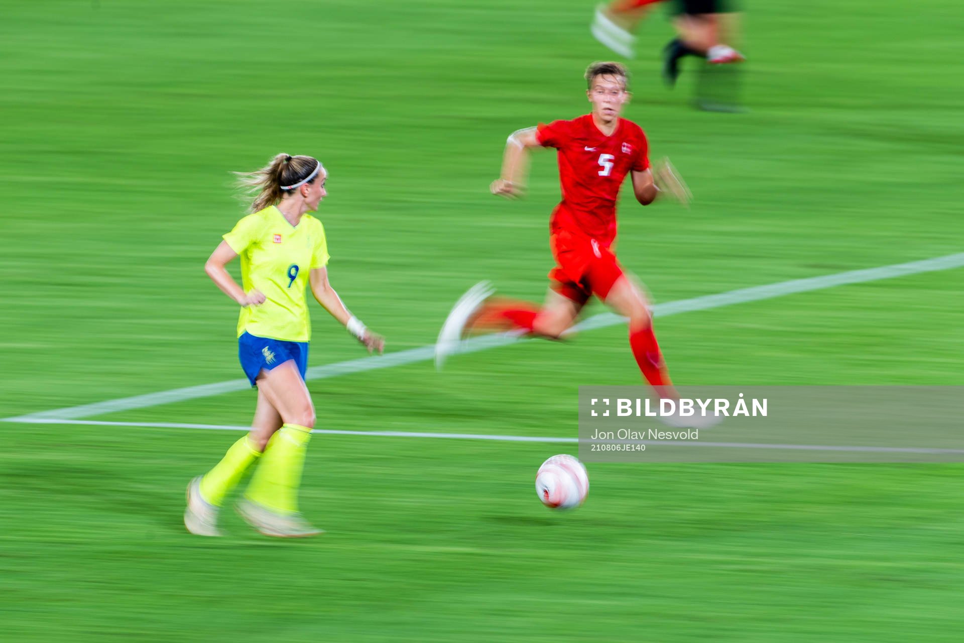 Kosovare Asllani of Sweden and Quinn of Canada in the