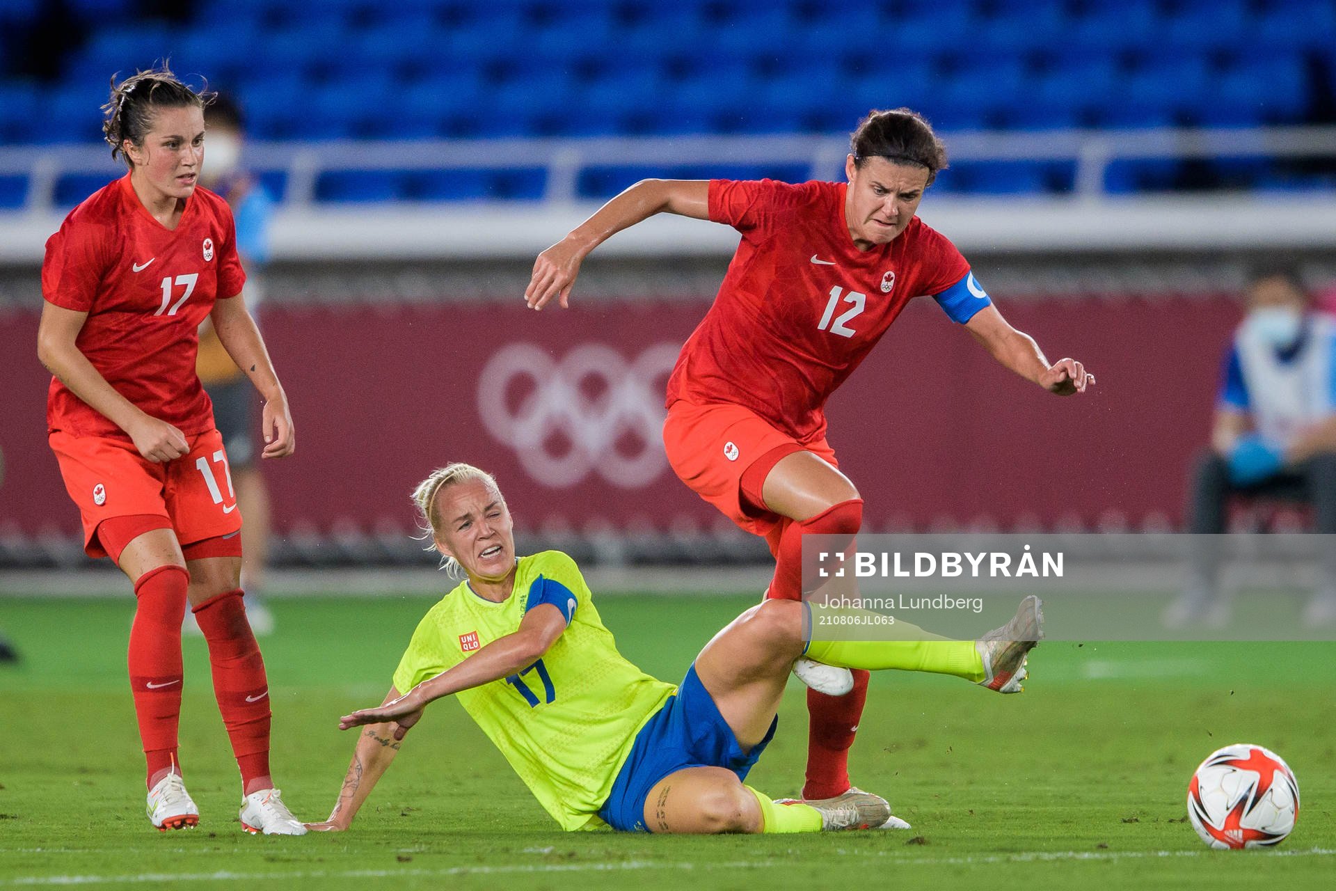 Jessie Fleming and Christine Sinclair of Canada against