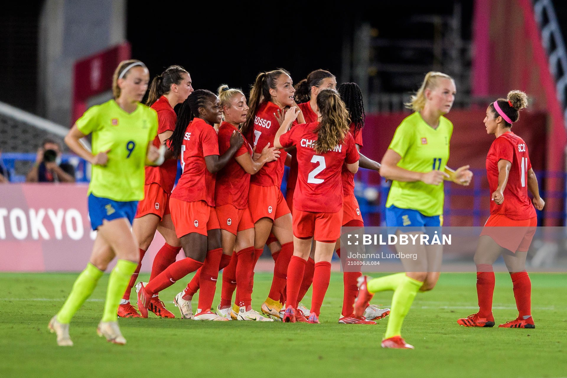 Jessie Fleming of Canada celebrates with teammates